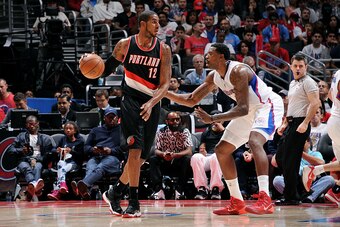 LOS ANGELES, CA - NOVEMBER 08: LaMarcus Aldridge #12 of the Portland Trail Blazers handles the ball against DeAndre Jordan #6 of the Los Angeles Clippers at STAPLES Center on November 08, 2014 in Los Angeles, California. NOTE TO USER: User expressly ackno
