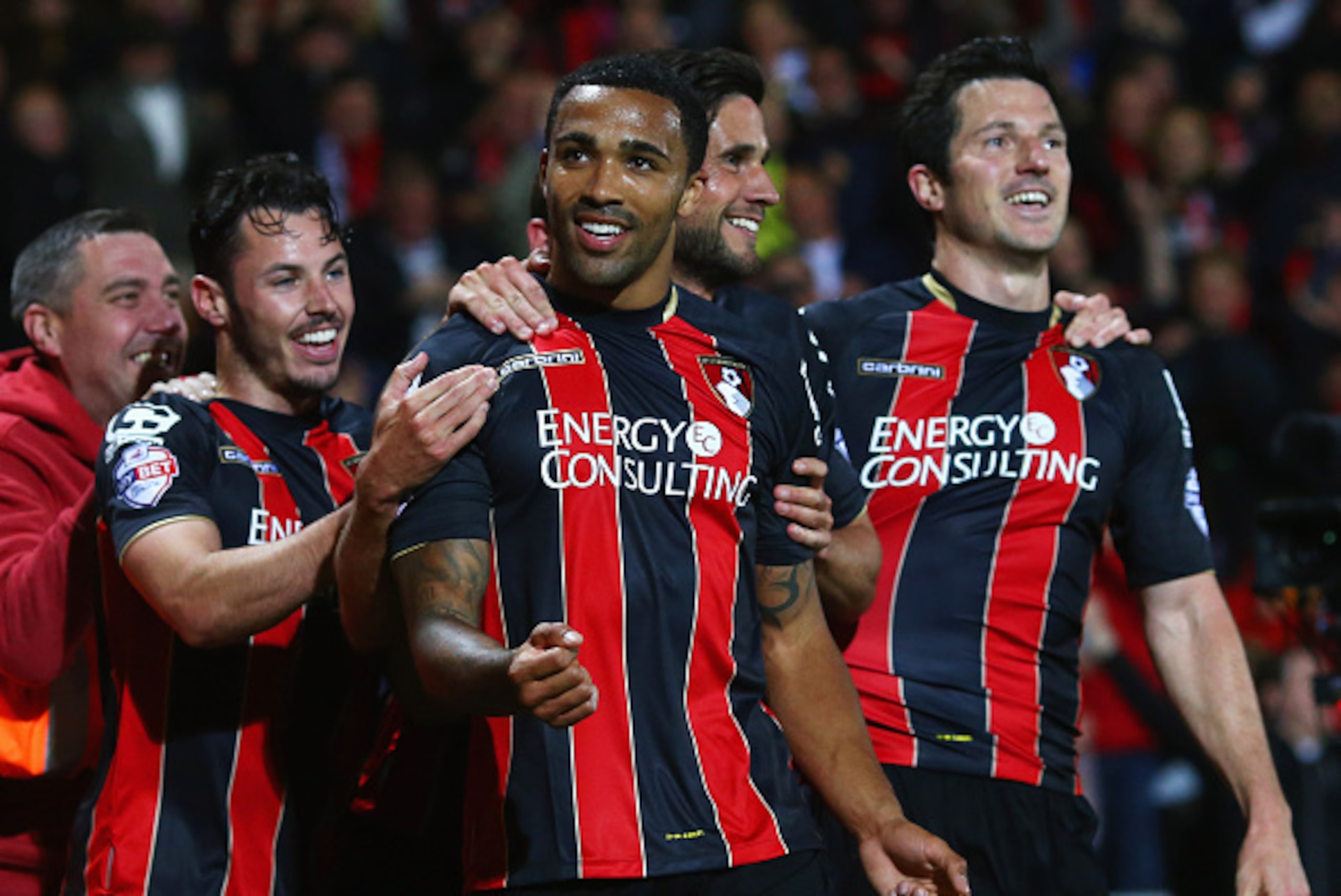 BOURNEMOUTH, ENGLAND - APRIL 27:  Callum Wilson of Bournemouth celebrates with team mates as he scores their third goal during the Sky Bet Championship match between AFC Bournemouth and Bolton Wanderers at Goldsands Stadium on April 27, 2015 in Bournemout