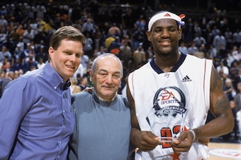 CHICAGO - MARCH 31:  LeBron James #23 of Team West stands alongside Roundball Chairman Sonny Vaccaro during the EA Sports Roundball Classic game against Team East at United Center on March 31, 2003 in Chicago, Illinois. Team West won 120-119.  NOTE TO USE