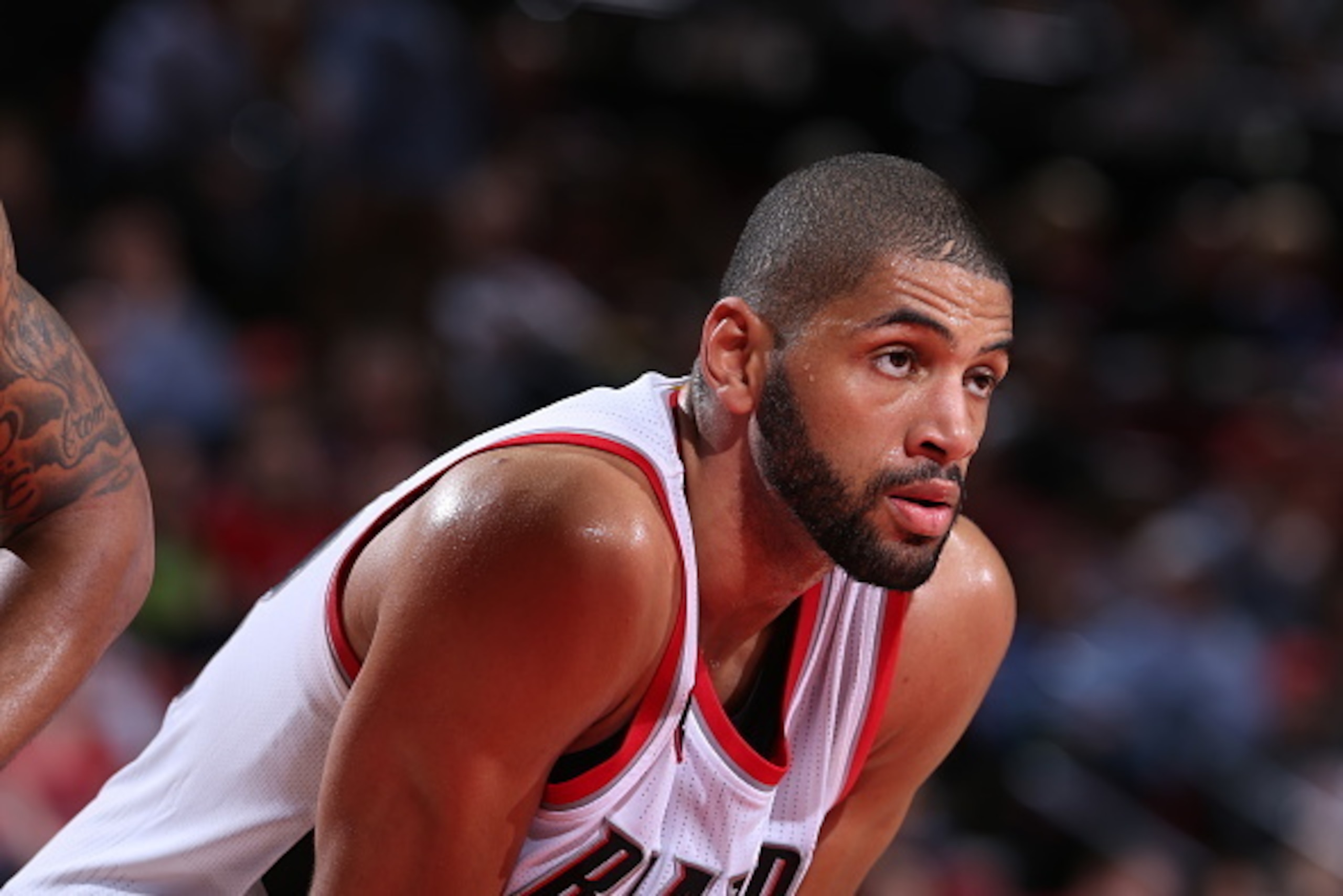 PORTLAND, OR - MARCH 30: Nicolas Batum #88 of the Portland Trail Blazers stands on the court during a game against the Phoenix Suns on March 30, 2015 at the Moda Center Arena in Portland, Oregon. NOTE TO USER: User expressly acknowledges and agrees that, 