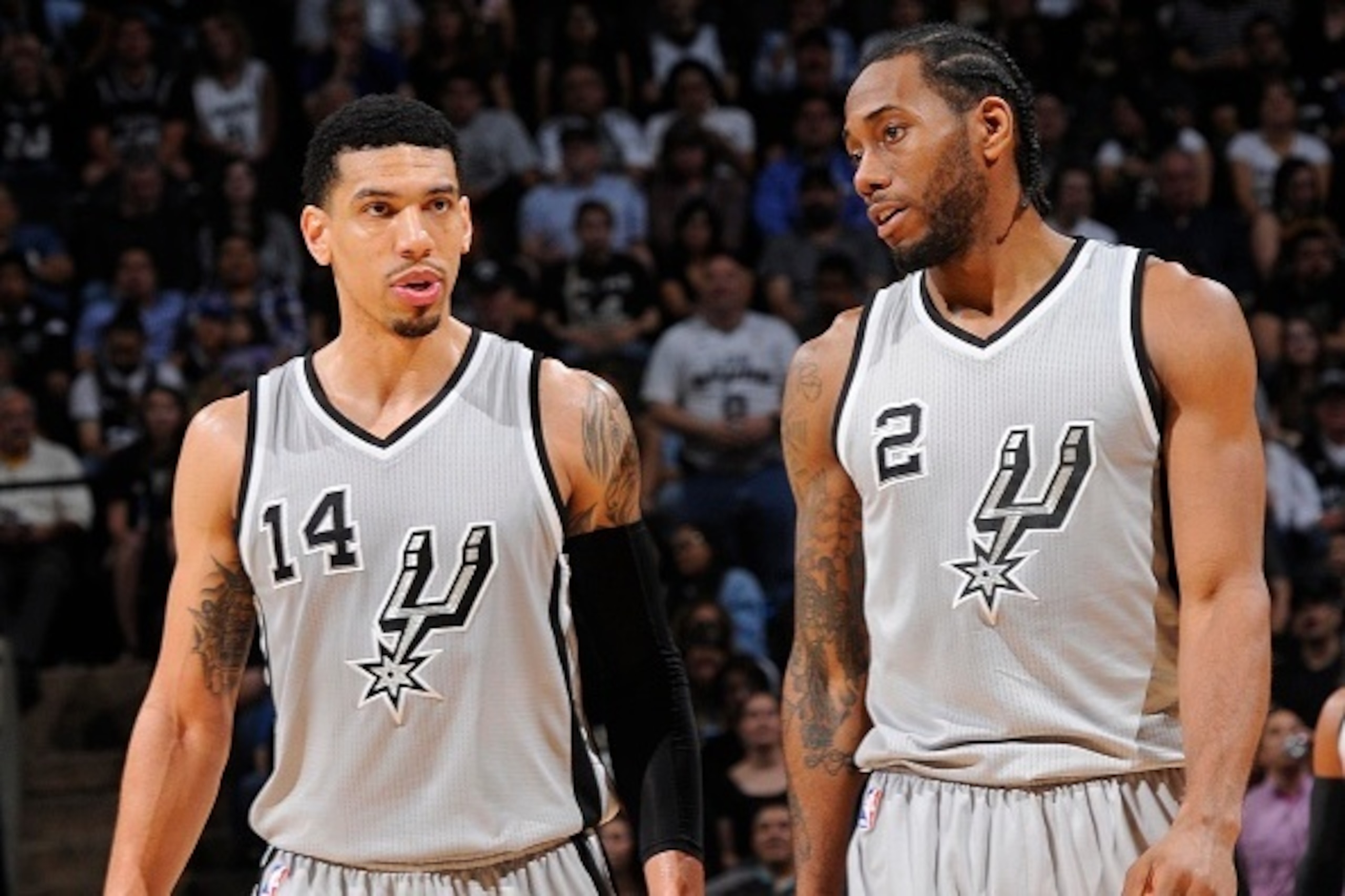 SAN ANTONIO - MARCH 27: Danny Green #14 and Kawhi Leonard #2 of the San Antonio Spurs during the game against the Dallas Mavericks at the AT&T Center on March 27, 2014 in San Antonio, Texas. NOTE TO USER: User expressly acknowledges and agrees that, by do