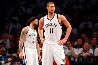 NEW YORK, NY - MAY 01:  Brook Lopez #11 and Deron Williams #8 of the Brooklyn Nets look on against the Atlanta Hawks during game six in the first round of the 2015 NBA Playoffs at Barclays Center on May 1, 2015 in the Brooklyn borough of New York City. NO