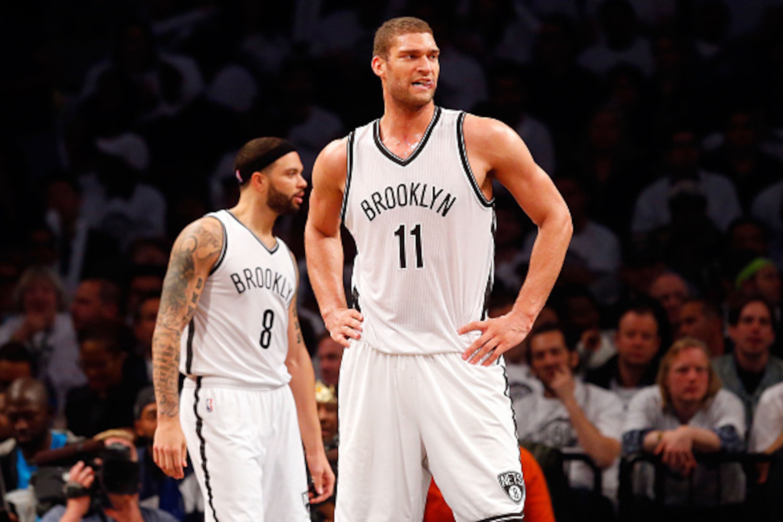 NEW YORK, NY - MAY 01:  Brook Lopez #11 and Deron Williams #8 of the Brooklyn Nets look on against the Atlanta Hawks during game six in the first round of the 2015 NBA Playoffs at Barclays Center on May 1, 2015 in the Brooklyn borough of New York City. NO