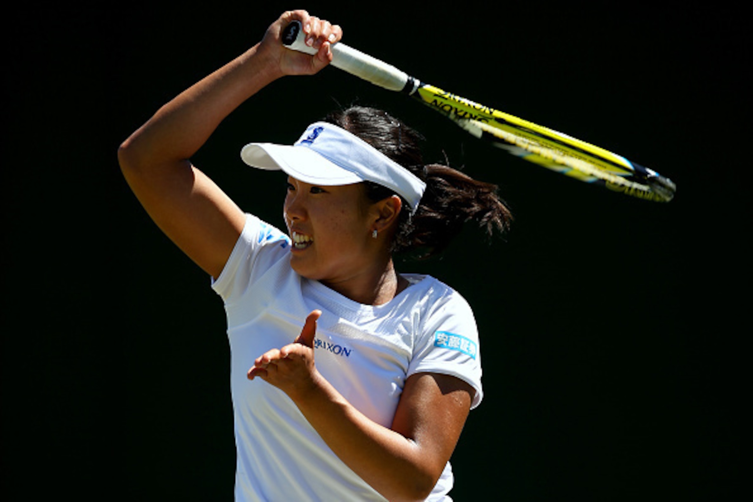 LONDON, ENGLAND - JUNE 30: Kurumi Nara of Japan in action in her Ladies Singles first round match against Magda Linette of Poland during day two of the Wimbledon Lawn Tennis Championships at the All England Lawn Tennis and Croquet Club on June 30, 2015 in