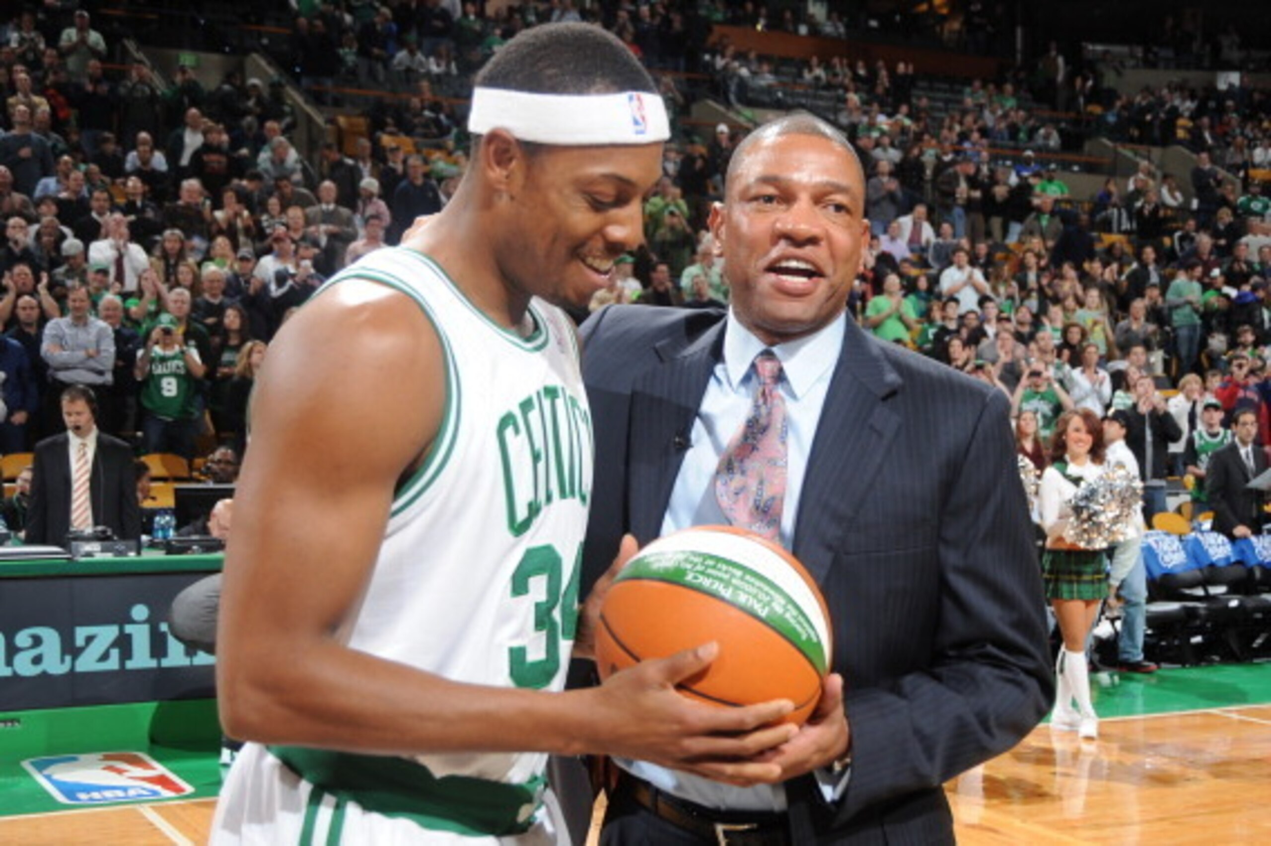 BOSTON - NOVEMBER 19:  Paul Pierce #34 of the Boston Celtics receives the game ball when he scored 20,000 points for his career from coach Doc Rivers before the game against the Oklahoma City Thunder on November 19, 2010 at the TD Garden in Boston, Massac