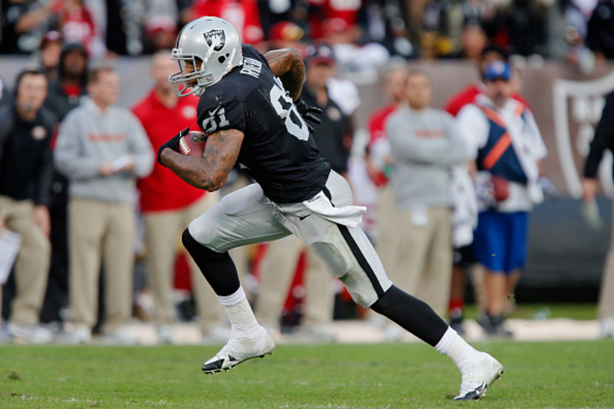 OAKLAND, CA - DECEMBER 7:  Tight end Mychal Rivera #81 of the Oakland Raiders picks up 27 yards on a catch against the San Francisco 49ers to start the fourth quarter on December 7, 2014 at O.co Coliseum in Oakland, California.  The Raiders won 24-13.  (P