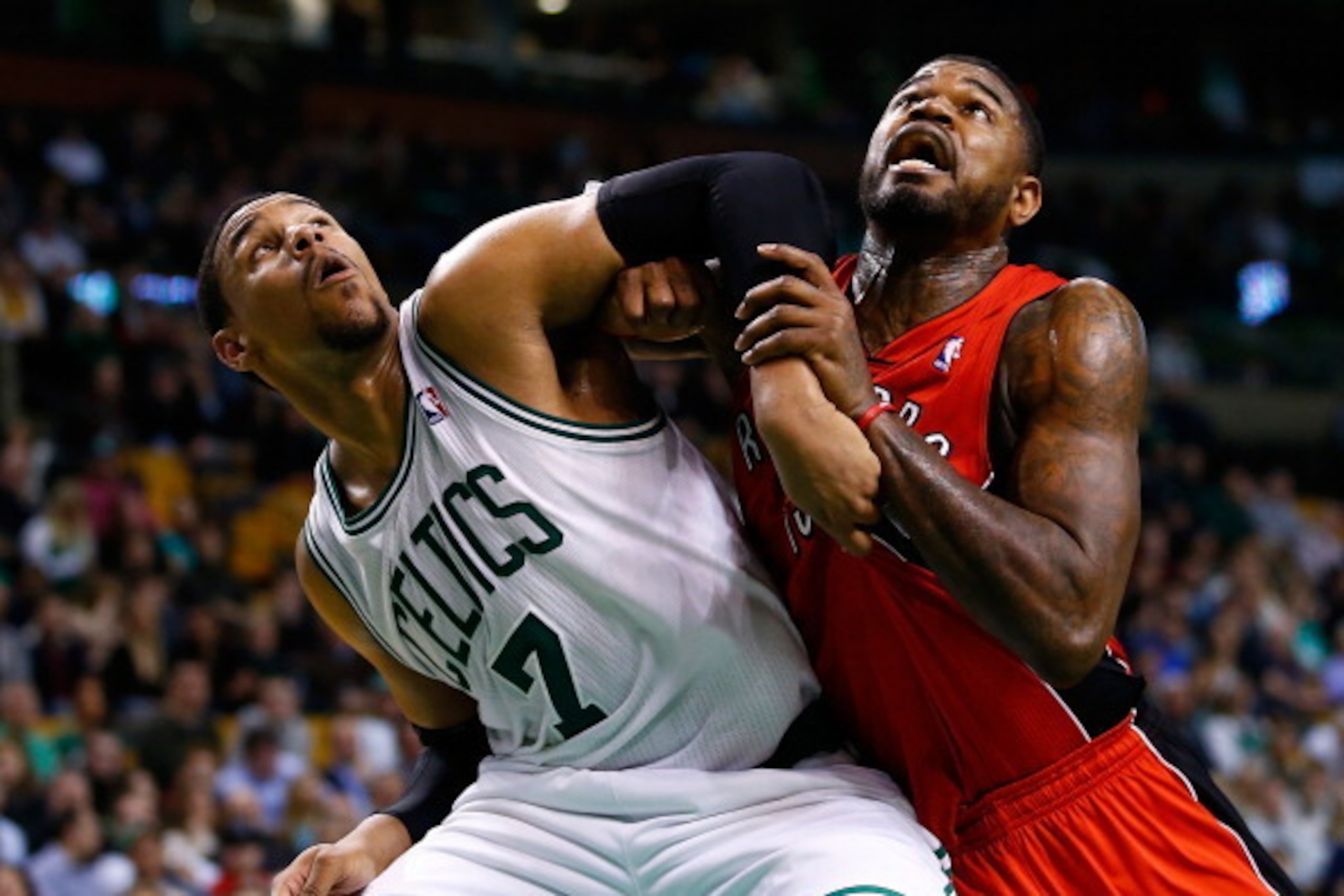 BOSTON, MA - JANUARY 15: Jared Sullinger #7 of the Boston Celtics and Amir Johnson #15 of the Toronto Raptors battle for position underneath the basket in the second half during the game at TD Garden on January 15, 2014 in Boston, Massachusetts. NOTE TO U BOSTON, MA - JANUARY 15: Jared Sullinger #7 of the Boston Celtics and Amir Johnson #15 of the Toronto Raptors battle for position underneath the basket in the second half during the game at TD Garden on January 15, 2014 in Boston, Massachusetts. NOTE TO U