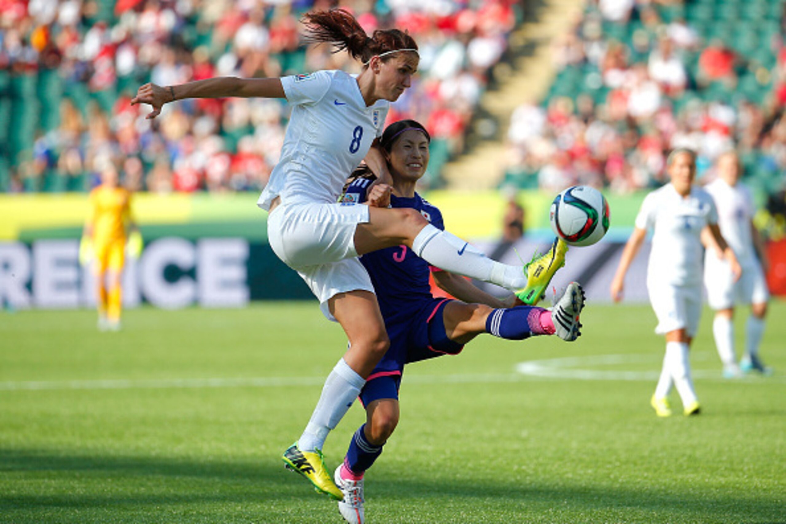 EDMONTON, AB - JULY 01:  Jill Scott #8 of England challenges Aya Sameshima #5 of Japan during the 2015 FIFA Women's World Cup Canada 2015 Semi Final match between Japan and England at Commonwealth Stadium on July 1, 2015 in Edmonton, Canada.  (Photo by Ke