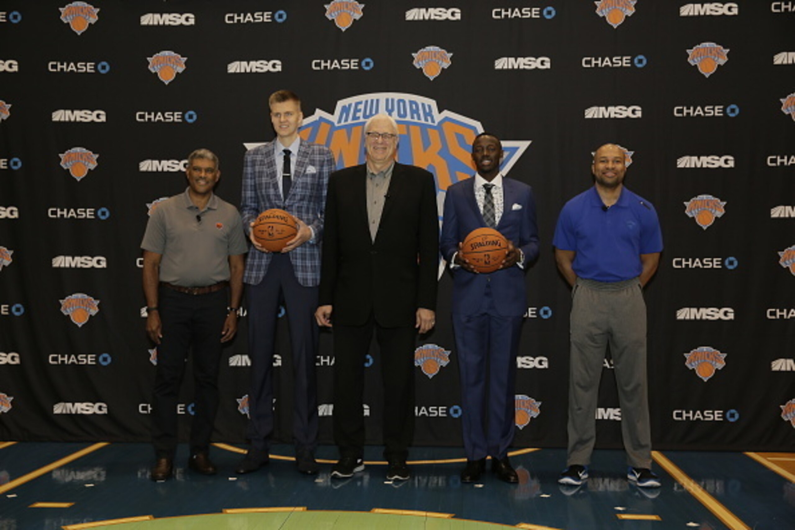 TARRYTOWN, NY - JUNE 26: L-R, General Manager Steve Mills,Kristaps Porzingis, first round Draft pick of the New York Knicks, President Phil Jackson, Jerian Grant, first round Draft pick and Head Coach Derek Fisher pose for a photo during a press conferenc