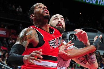 ATLANTA, GA - JANUARY 30: LaMarcus Aldridge #12 of the Portland Trail Blazers boxes out against Pero Antic #6 of the Atlanta Hawks on January 30, 2015 at Philips Arena in Atlanta, Georgia.  NOTE TO USER: User expressly acknowledges and agrees that, by dow
