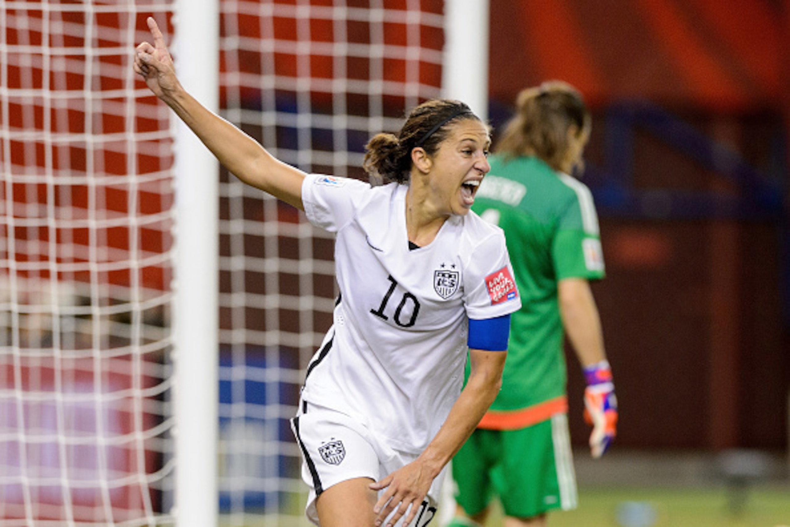 MONTREAL, QC - JUNE 30:  Carli Lloyd #10 of the United States celebrates after assisting on the goal by Kelley O'Hara #5 in the second half against Germany in the FIFA Women's World Cup 2015 Semi-Final Match at Olympic Stadium on June 30, 2015 in Montreal