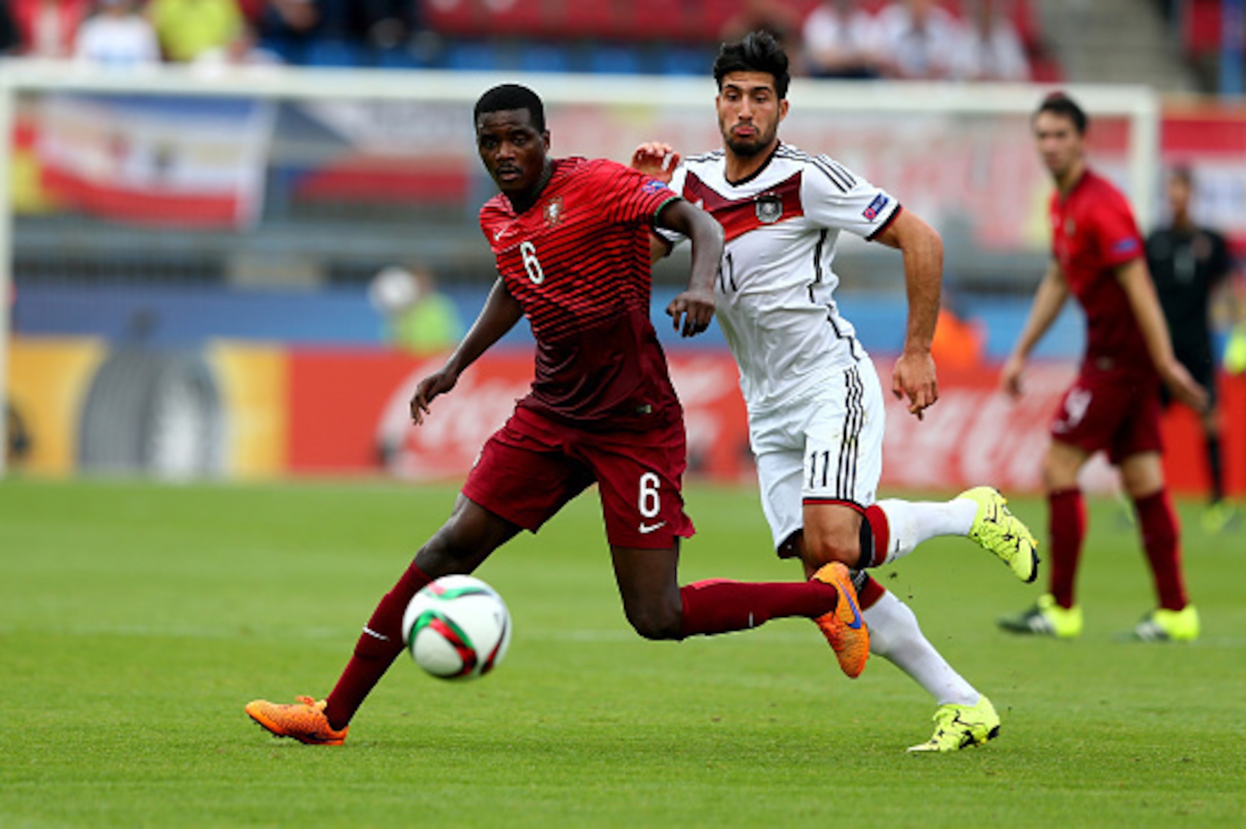 OLOMOUC, CZECH REPUBLIC - JUNE 27: William Carvalho (L) of Portugal and Emre Can of Germany battle for the ball during the UEFA European Under-21 semi final match Between Portugal and Germany at Ander Stadium on June 27, 2015 in Olomouc, Czech Republic.  