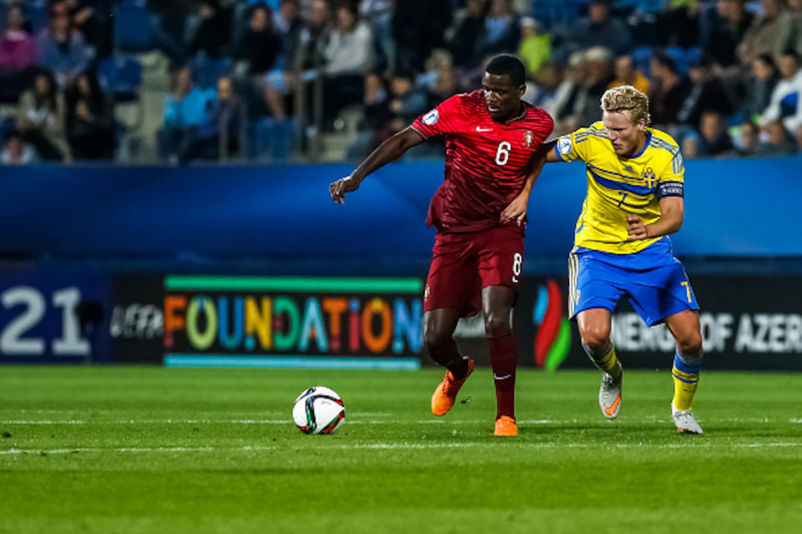 UHERSKE HRADISTE, CZECH REPUBLIC - JUNE 24:  William Carvalho (L) of Portugal battles for the ball with Oscar Hiljemark (R) of Sweden during UEFA U21 European Championship Group B match between Portugal and Sweden at Mestsky Fotbalovy Stadium on June 24, 