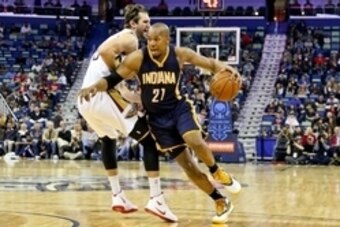 Feb 11, 2015; New Orleans, LA, USA; Indiana Pacers forward David West (21) drives past New Orleans Pelicans center Jeff Withey (5) during the first quarter of a game at the Smoothie King Center. Mandatory Credit: Derick E. Hingle-USA TODAY Sports