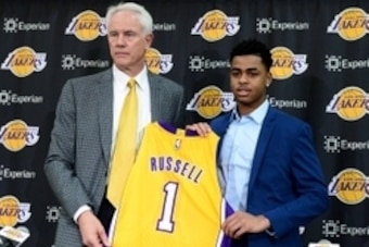 Jun 29, 2015; Los Angeles, CA, USA; Los Angeles Lakers guard D'Angelo Russell (1) is introduced to the media by general manager Mitch Kupchak during a press conference at the Toyota Sports Center. Mandatory Credit: Jayne Kamin-Oncea-USA TODAY Sports