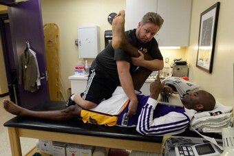 LOS ANGELES, CA - DECEMBER 8: Kobe Bryant #24 of the Los Angeles Lakers is worked on in the training room before a game against the Toronto Raptors on December 8, 2013 at STAPLES Center in Los Angeles, California. NOTE TO USER: User expressly acknowledges