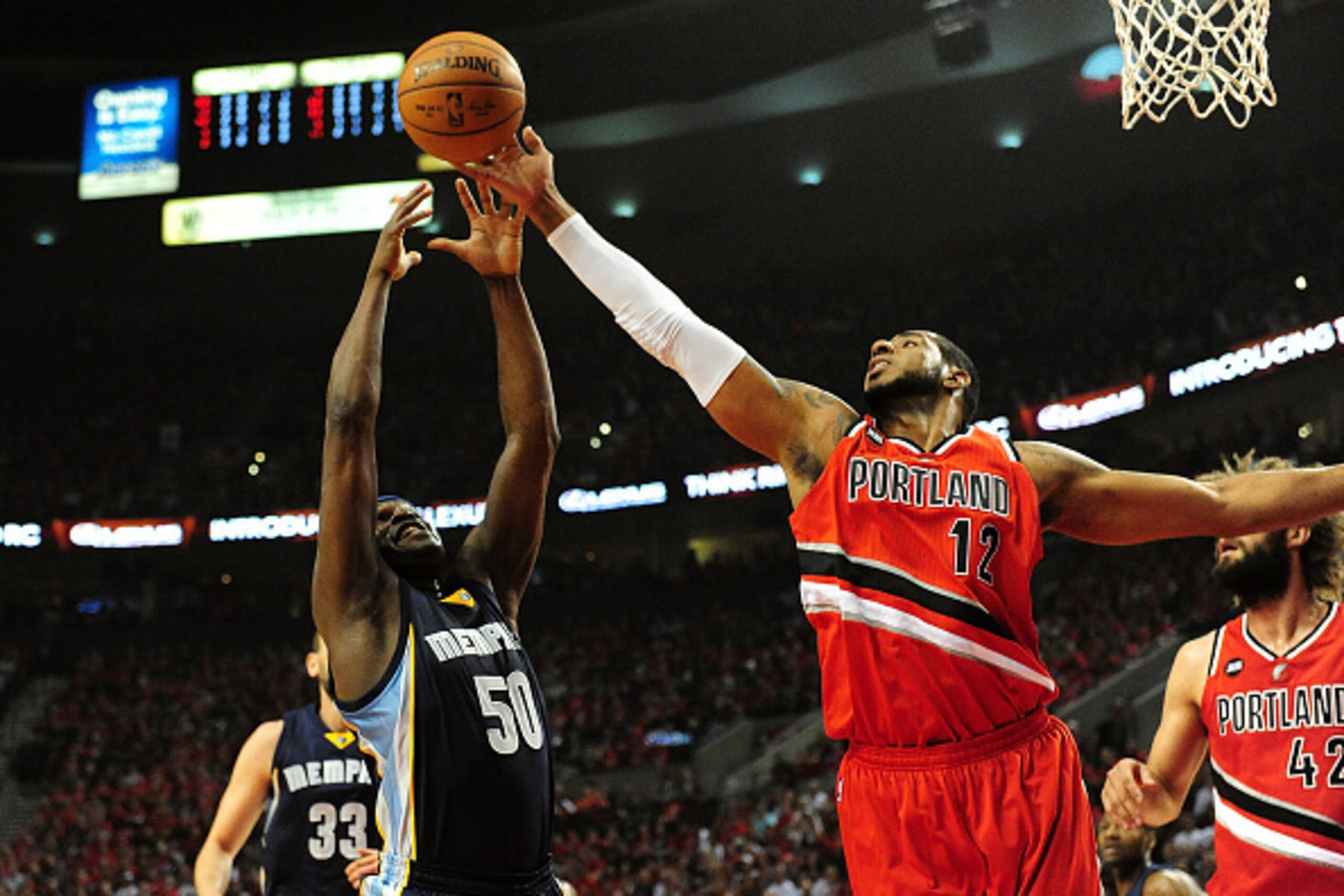 PORTLAND, OR - APRIL 25: Zach Randolph #50 of the Memphis Grizzlies and LaMarcus Aldridge #12 of the Portland Trail Blazers battle for a rebound during the first quarter in Game Three of the Western Conference quarterfinals during the 2015 NBA Playoffs at