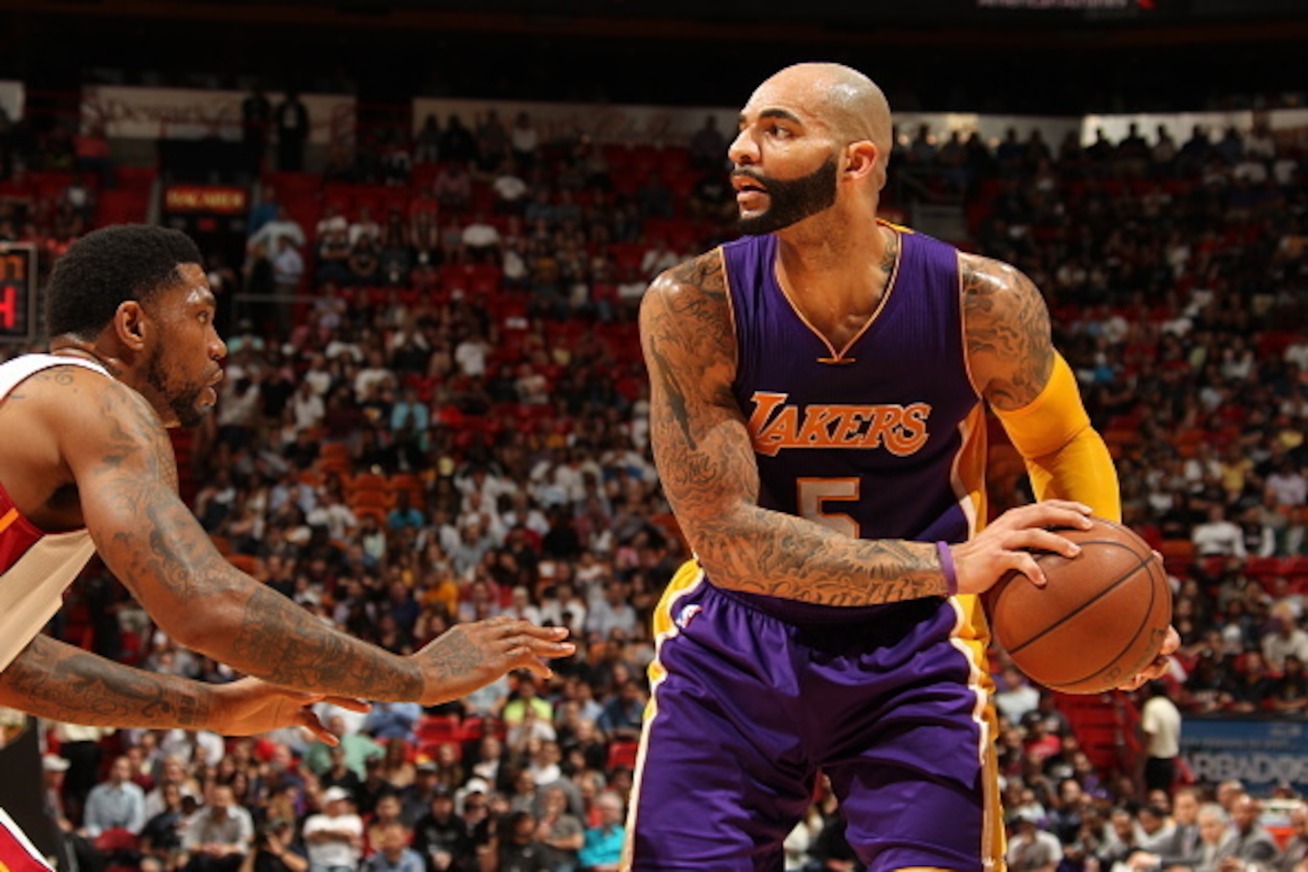 MIAMI, FL - MARCH 4:  Carlos Boozer #5 of the Los Angeles Lakers handles the ball against the Miami Heat on March 4, 2015 at American Airlines Arena in Miami, Florida.  NOTE TO USER: User expressly acknowledges and agrees that, by downloading and or using