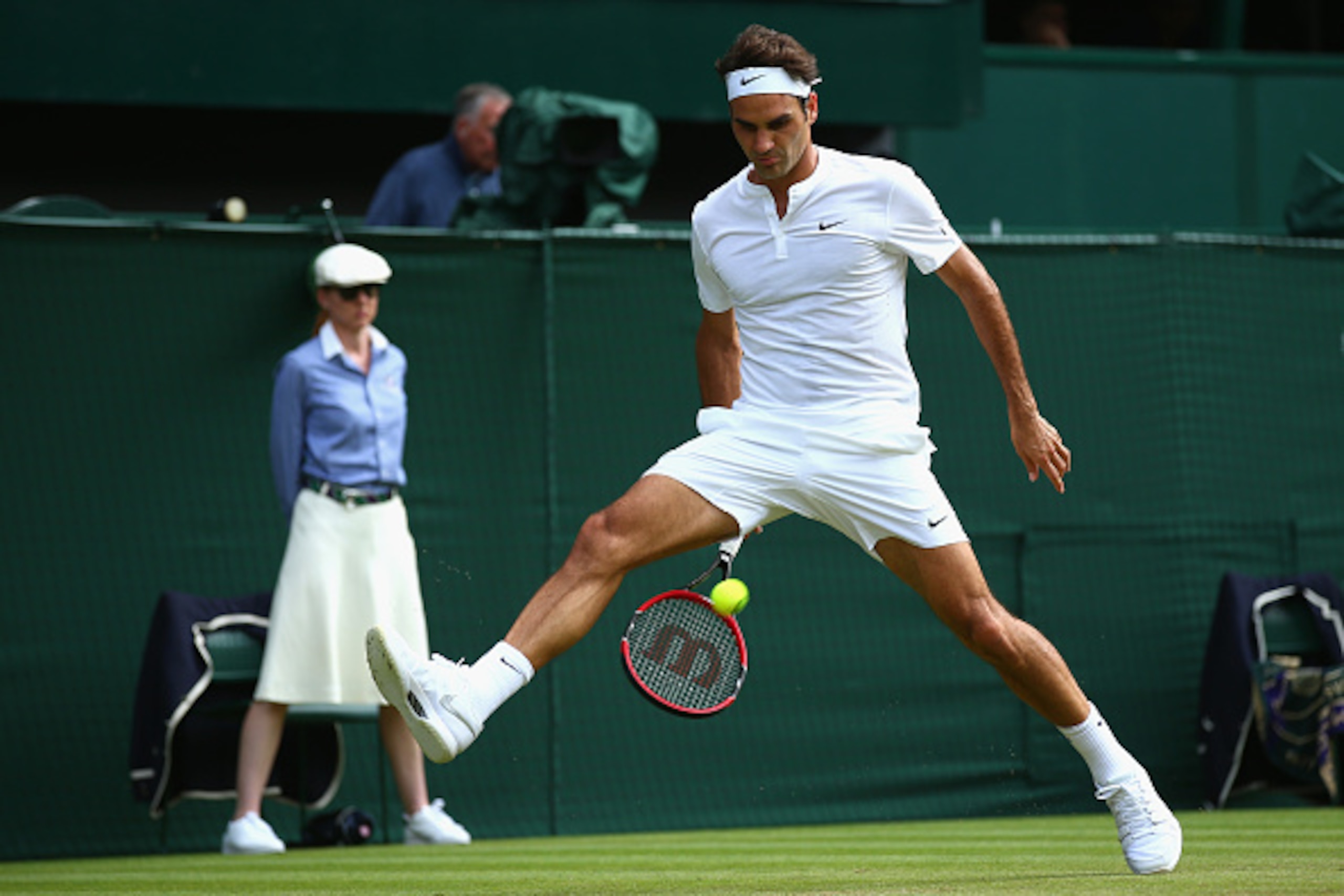 LONDON, ENGLAND - JULY 02: Roger Federer of Switzerland plays a whot through the legs during his Gentlemens Singles Second Round match against Sam Querry of the United States during day four of the Wimbledon Lawn Tennis Championships at the All England L LONDON, ENGLAND - JULY 02: Roger Federer of Switzerland plays a whot through the legs during his Gentlemens Singles Second Round match against Sam Querry of the United States during day four of the Wimbledon Lawn Tennis Championships at the All England L