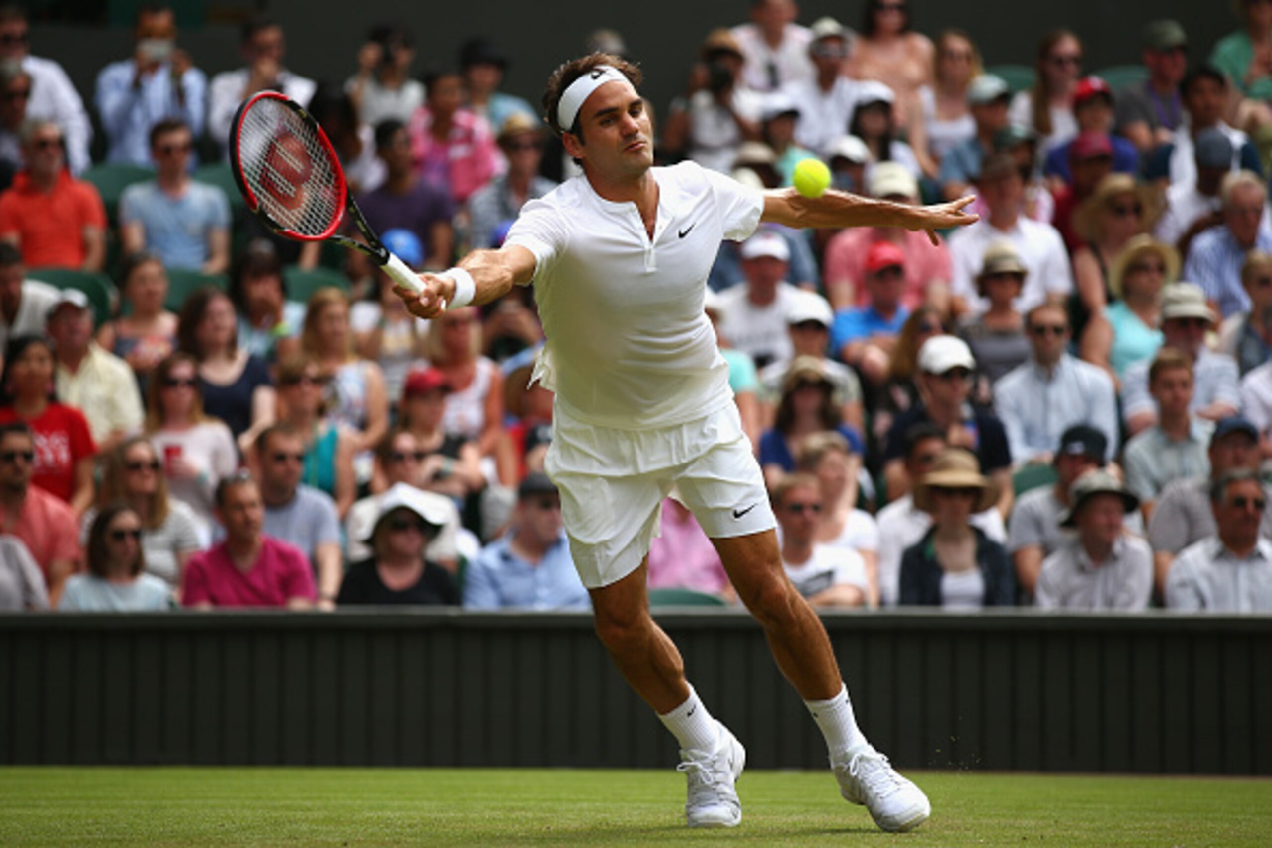 LONDON, ENGLAND - JULY 02: Roger Federer of Switzerland plays a forehand during his Gentlemens Singles Second Round match against Sam Querry of the United States during day four of the Wimbledon Lawn Tennis Championships at the All England Lawn Tennis an LONDON, ENGLAND - JULY 02: Roger Federer of Switzerland plays a forehand during his Gentlemens Singles Second Round match against Sam Querry of the United States during day four of the Wimbledon Lawn Tennis Championships at the All England Lawn Tennis an