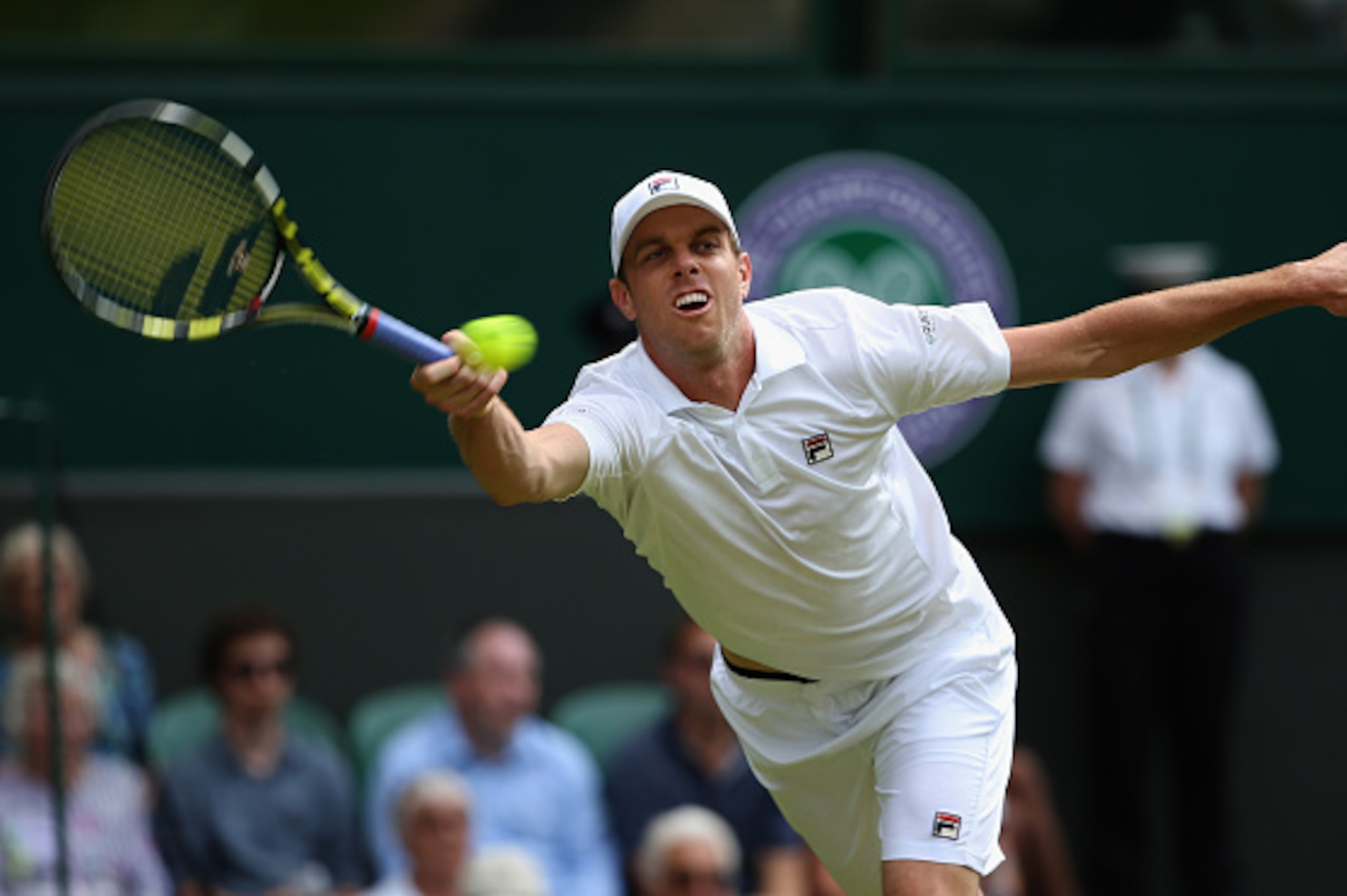 LONDON, ENGLAND - JULY 02: Sam Querry of the United States plays a forehand during his Gentlemens Singles Second Round match against Roger Federer of Switzerland during day four of the Wimbledon Lawn Tennis Championships at the All England Lawn Tennis an LONDON, ENGLAND - JULY 02: Sam Querry of the United States plays a forehand during his Gentlemens Singles Second Round match against Roger Federer of Switzerland during day four of the Wimbledon Lawn Tennis Championships at the All England Lawn Tennis an