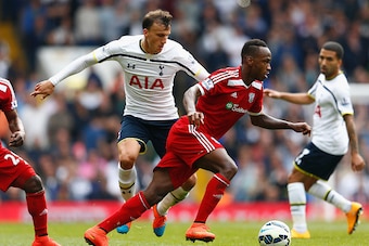 LONDON, ENGLAND - SEPTEMBER 21:  Vlad Chiriches of Spurs is challehned by Saido Berahino of West Brom during the Barclays Premier League match between Tottenham Hotspur and West Bromwich Albion at White Hart Lane on September 21, 2014 in London, England. 
