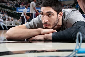 DALLAS, TX - FEBRUARY 11: Enes Kanter #0 of the Utah Jazz stretches before a game against the Dallas Mavericks on February 11, 2015 at the American Airlines Center in Dallas, Texas. NOTE TO USER: User expressly acknowledges and agrees that, by downloading