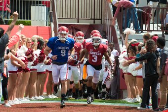 Apr 11, 2015; Norman, OK, USA; Oklahoma Sooners quarterback Trevor Knight (9) leads the team during the spring football game at Gaylord Family Oklahoma Memorial Stadium. Mandatory Credit: Rob Ferguson-USA TODAY Sports