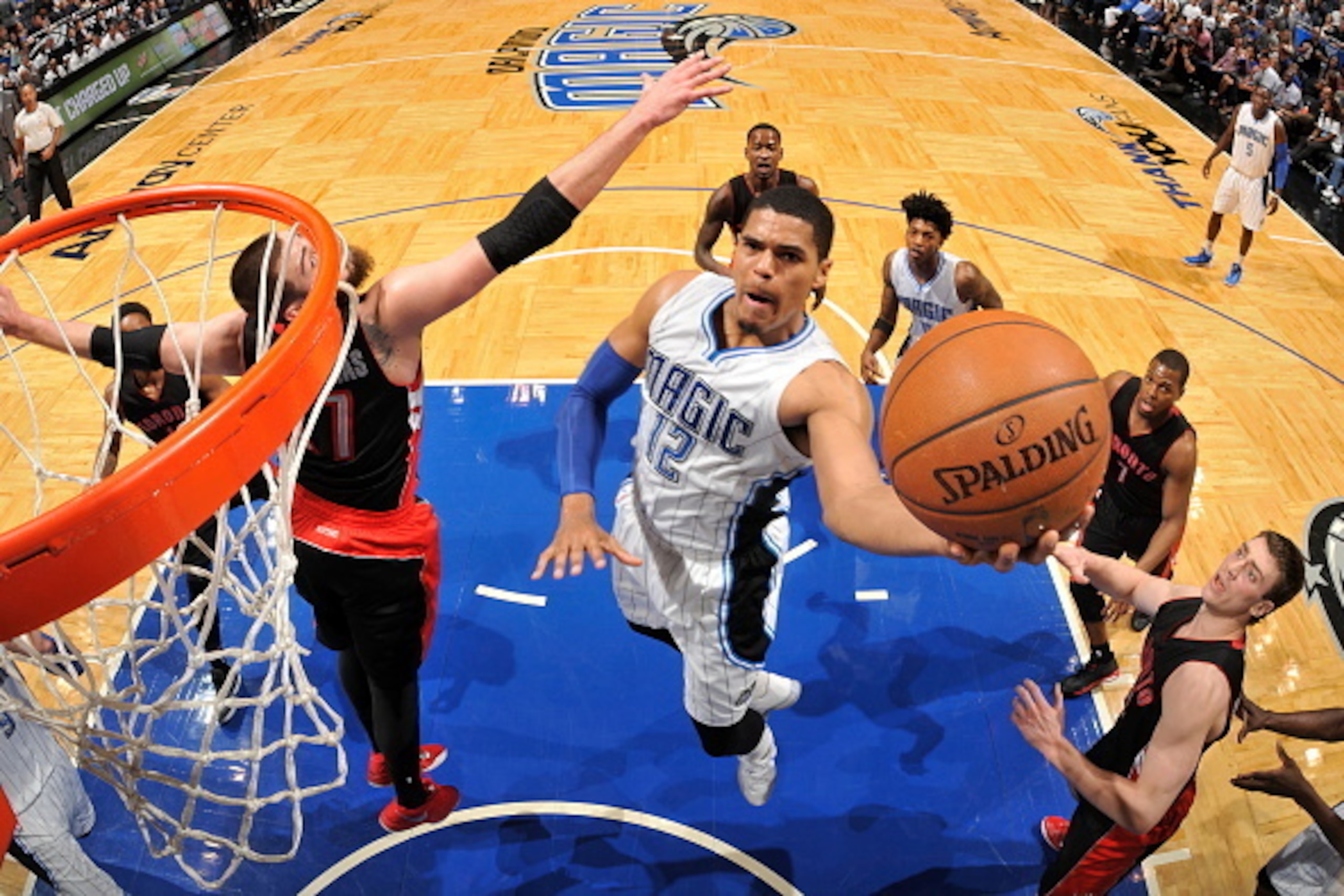 ORLANDO, FL - APRIL 10:  Tobias Harris #12 of the Orlando Magic goes up for a shot against the Toronto Raptors on April 10, 2015 at Amway Center in Orlando, Florida. NOTE TO USER: User expressly acknowledges and agrees that, by downloading and or using th
