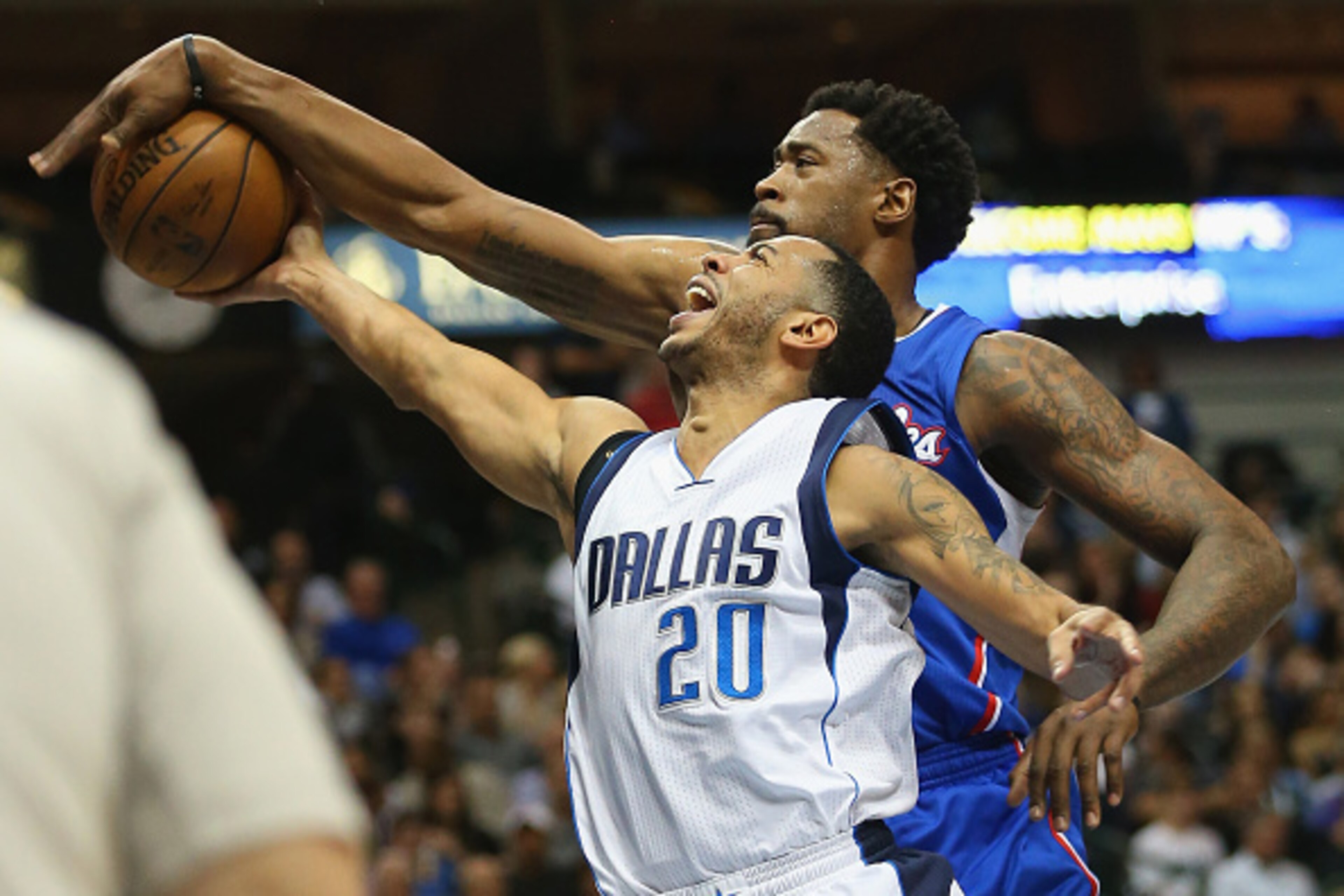 DALLAS, TX - FEBRUARY 09:  Devin Harris #20 of the Dallas Mavericks takes a shot against DeAndre Jordan #6 of the Los Angeles Clippers at American Airlines Center on February 9, 2015 in Dallas, Texas.  NOTE TO USER: User expressly acknowledges and agrees 