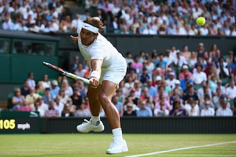 LONDON, ENGLAND - JULY 02:  Rafael Nadal of Spain plays a backhand in his Gentlemens Singles Second Round match against  Dustin Brown of Germany during day four of the Wimbledon Lawn Tennis Championships at the All England Lawn Tennis and Croquet Club on 