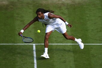 LONDON, ENGLAND - JULY 02:  Dustin Brown of Germany plays a volley in his Gentlemens Singles Second Round match against Rafael Nadal of Spain during day four of the Wimbledon Lawn Tennis Championships at the All England Lawn Tennis and Croquet Club on Jul