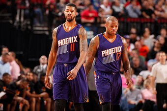 PORTLAND, OR - MARCH 30: Markieff Morris #11 and P.J. Tucker #17 of the Phoenix Suns during the game on March 30, 2015 at Moda Center in Portland, Oregon. NOTE TO USER: User expressly acknowledges and agrees that, by downloading and/or using this photogra