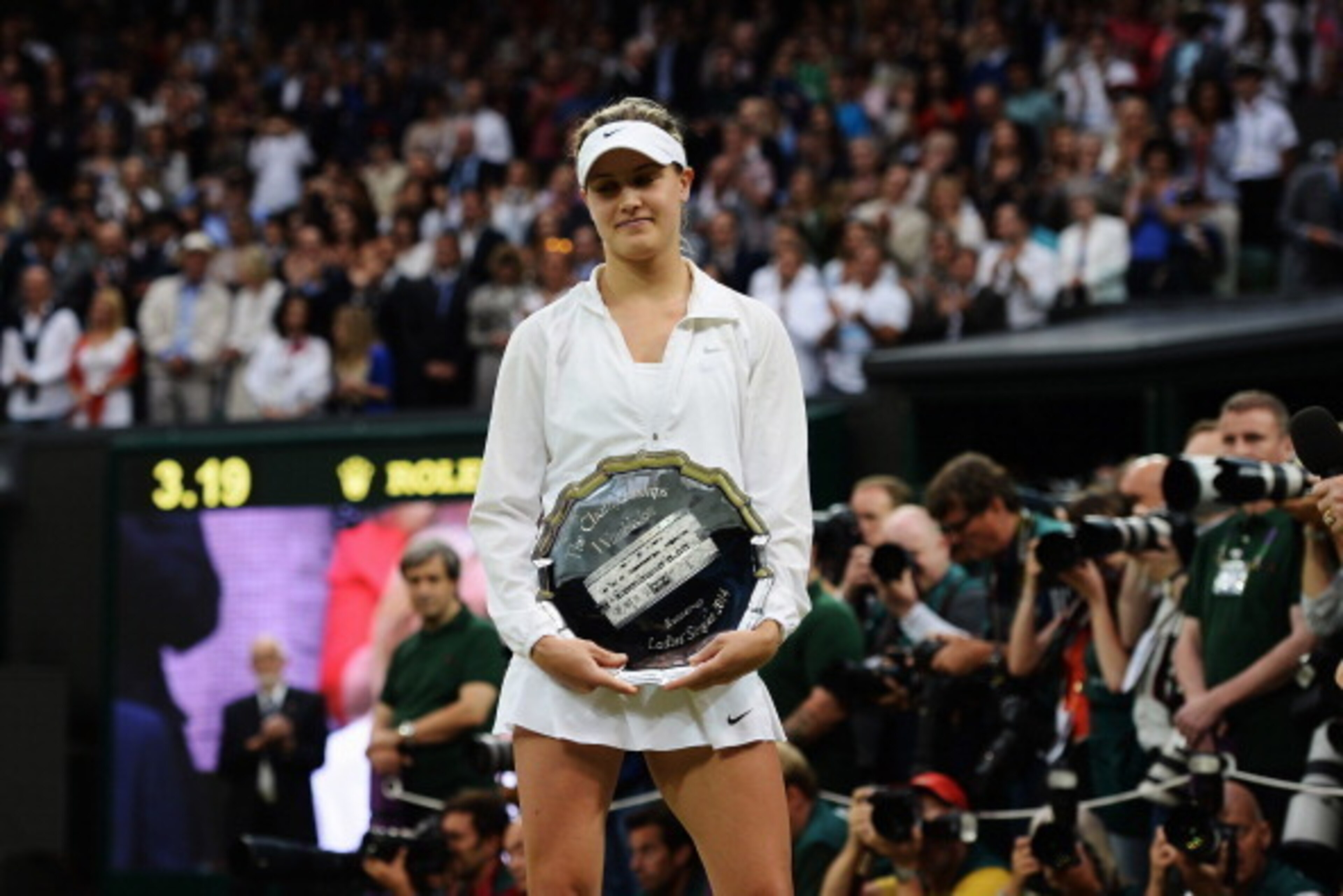 LONDON, ENGLAND - JULY 05: Eugenie Bouchard of Canada poses with the runner-up trophy after the Ladies' Singles final match against Petra Kvitova of Czech Republic on day twelve of the Wimbledon Lawn Tennis Championships at the All England Lawn Tennis an LONDON, ENGLAND - JULY 05: Eugenie Bouchard of Canada poses with the runner-up trophy after the Ladies' Singles final match against Petra Kvitova of Czech Republic on day twelve of the Wimbledon Lawn Tennis Championships at the All England Lawn Tennis an
