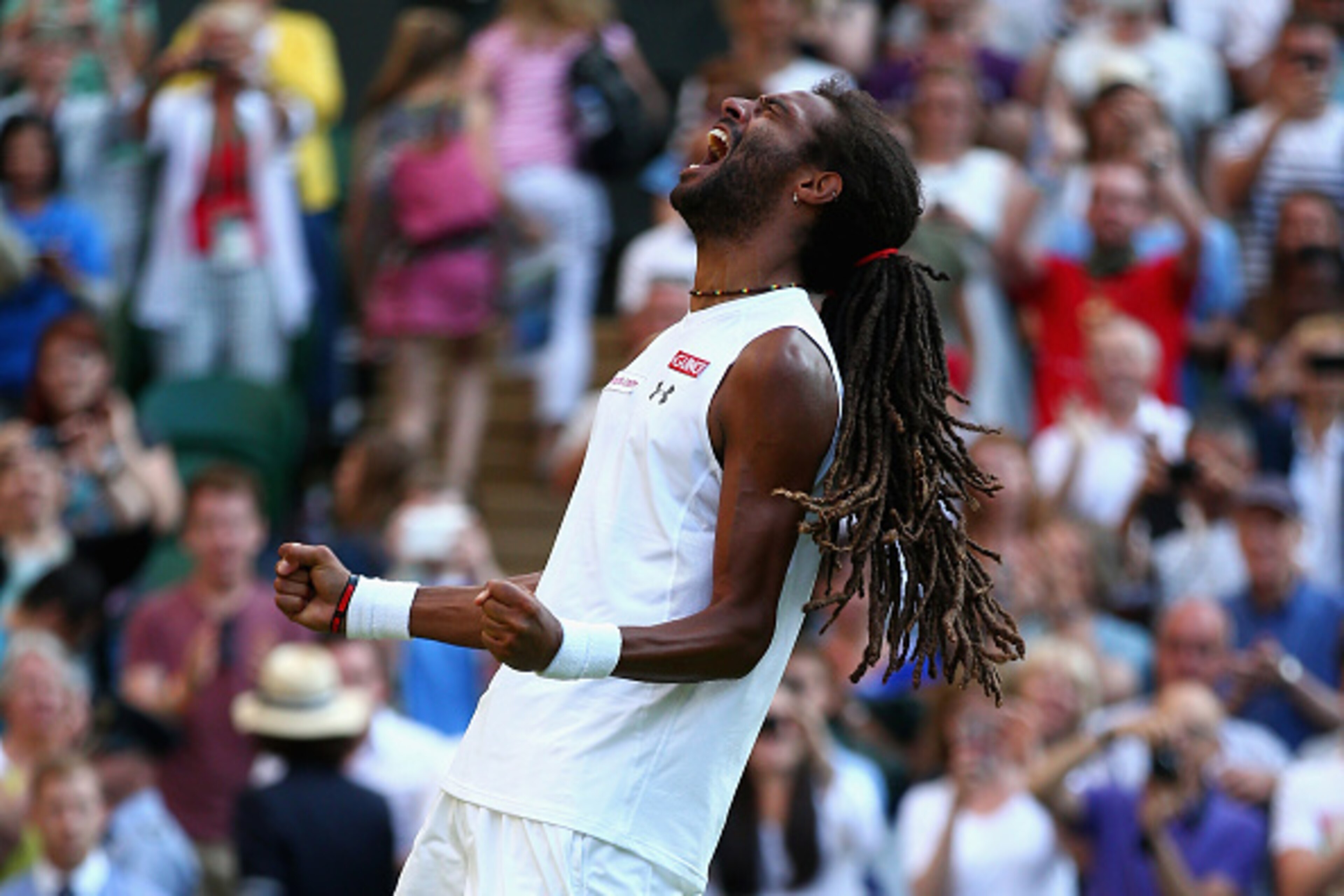 LONDON, ENGLAND - JULY 02:  Dustin Brown of Germany celebrates winning his Gentlemens Singles Second Round match against Rafael Nadal of Spain during day four of the Wimbledon Lawn Tennis Championships at the All England Lawn Tennis and Croquet Club on Ju