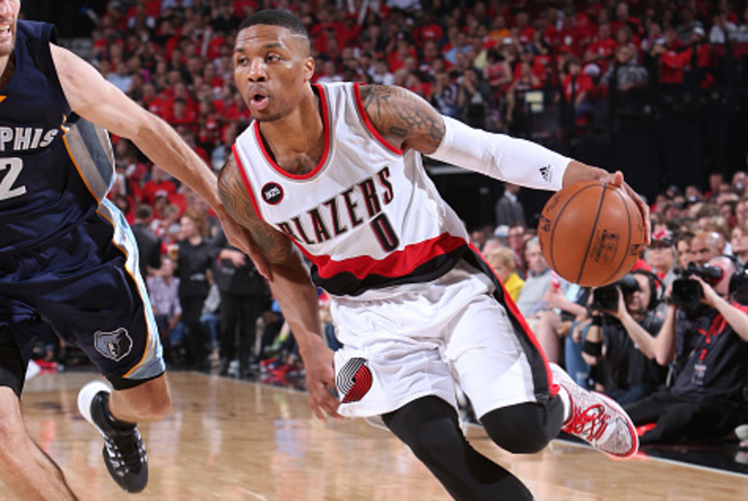 PORTLAND, OR - APRIL 27: Damian Lillard #0 of the Portland Trail Blazers handles the ball against the Memphis Grizzlies in Game Four of the Western Conference Quarterfinals during the 2015 NBA Playoffs on April 27, 2015 at the Moda Center in Portland, Ore