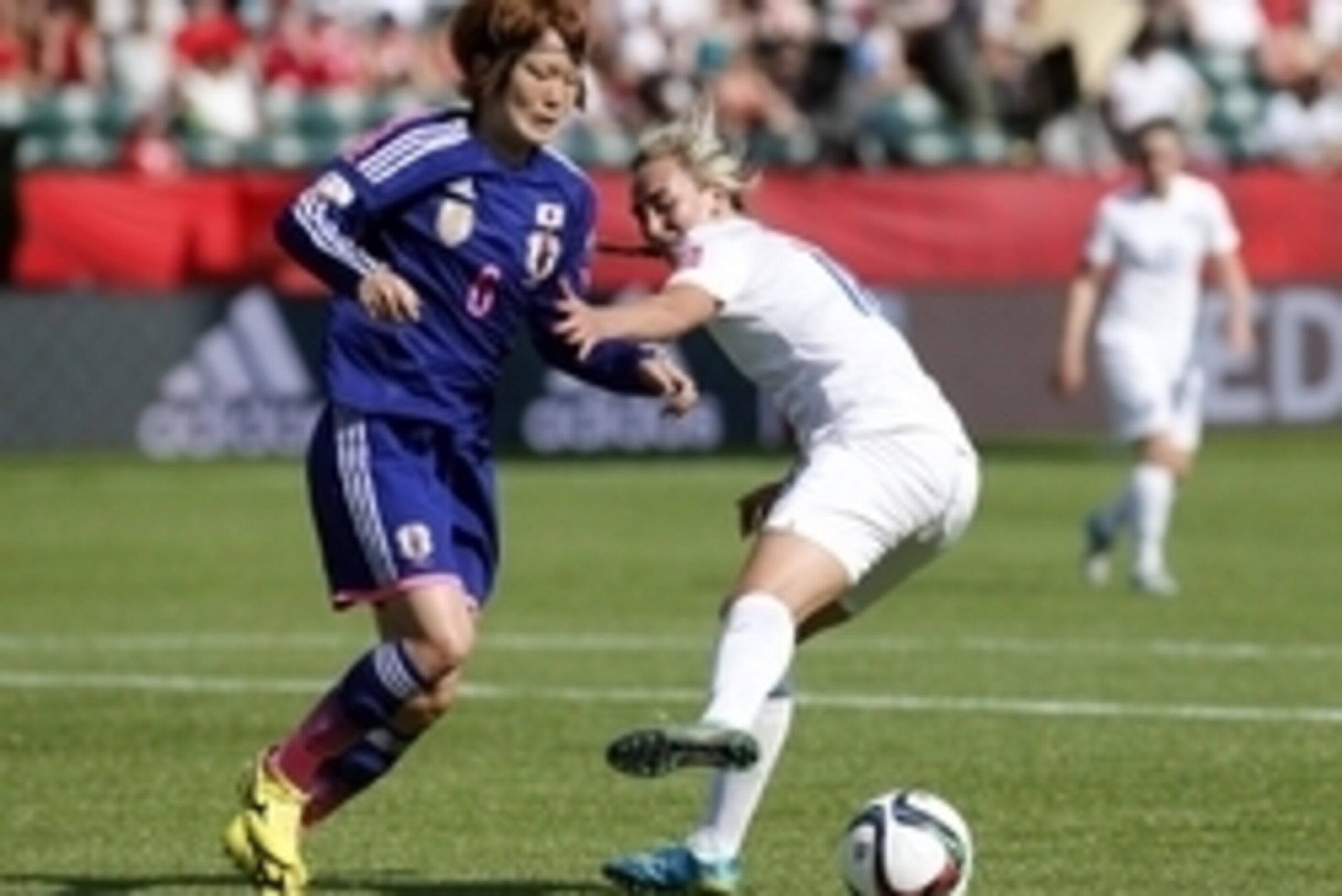 Jul 1, 2015; Edmonton, Alberta, CAN; Japan midfielder Mizuho Sakaguchi (6) and England forward Toni Duggan (18) fight for the ball during the first half in the semifinals of the FIFA 2015 Women's World Cup at Commonwealth Stadium. Mandatory Credit: Erich 