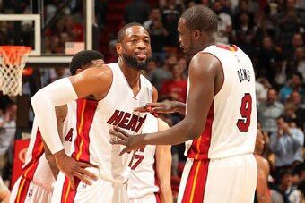 MIAMI, FL - MARCH 18: Dwyane Wade #3 and Luol Deng #9 of the Miami Heat during the game on March 18, 2015 at AmericaAirlines Arena in Miami, Florida. NOTE TO USER: User expressly acknowledges and agrees that, by downloading and/or using this photograph, U