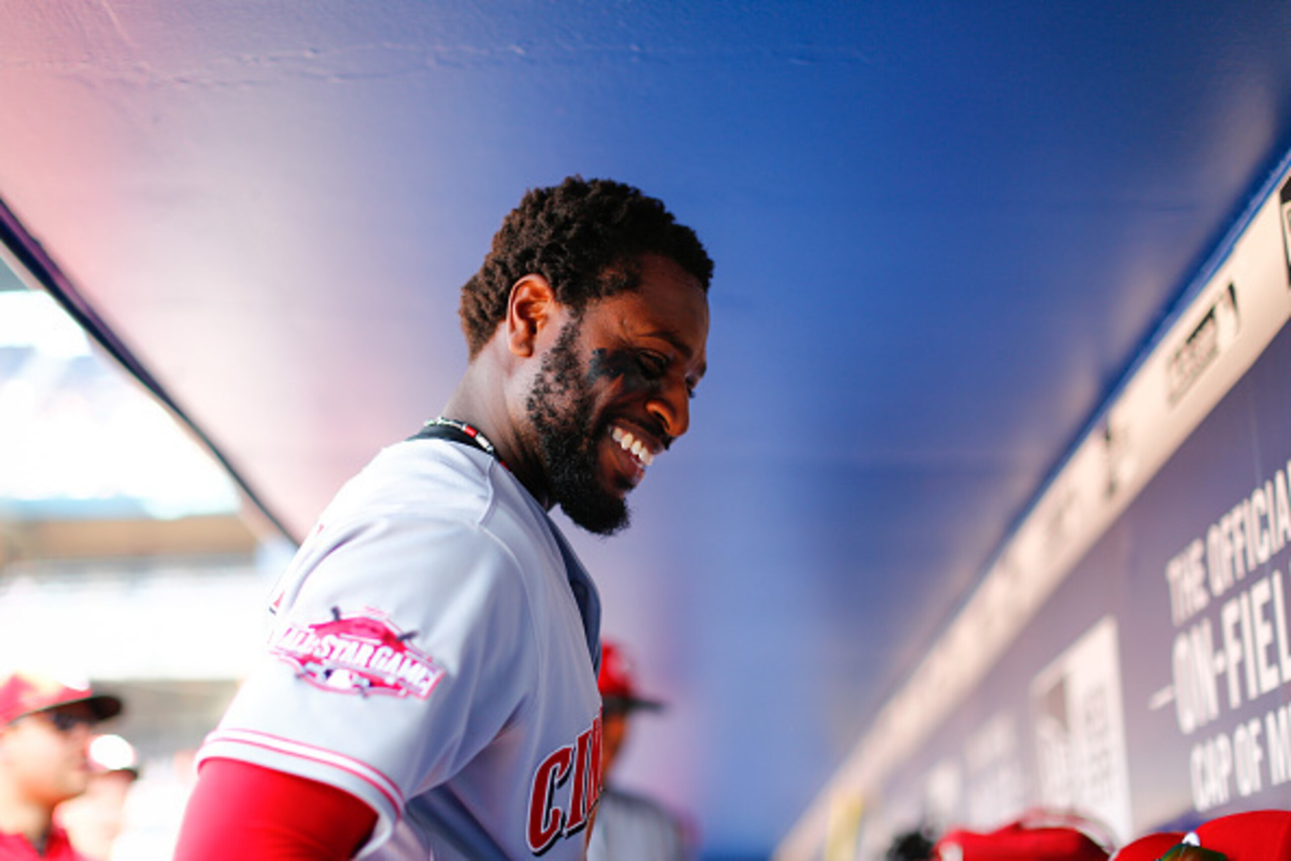 ATLANTA, GA - MAY 3:  Brandon Phillips #4 of the Cincinnati Reds smiles in the dugout during the fourth inning against the Atlanta Braves at Turner Field on May 3, 2015 in Atlanta, Georgia. The Braves defeated the Reds 5-0. (Photo by Kevin Liles/Getty Ima