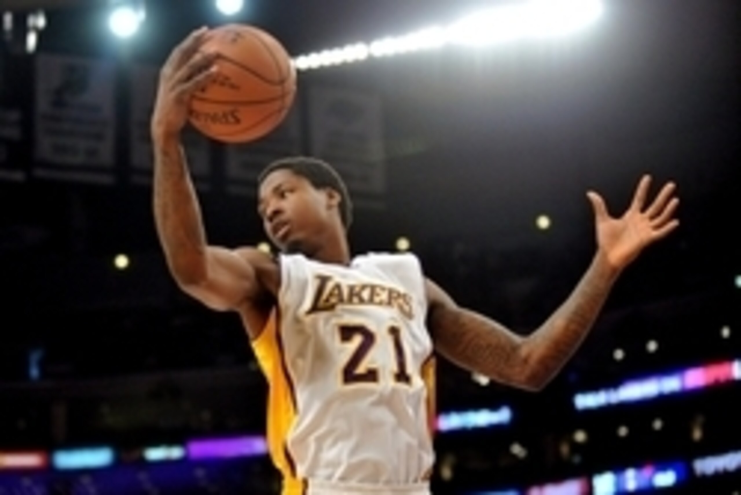 April 12, 2015; Los Angeles, CA, USA; Los Angeles Lakers  forward Ed Davis (21) grabs a rebound against the Dallas Mavericks during the first half at Staples Center. Mandatory Credit: Gary A. Vasquez-USA TODAY Sports