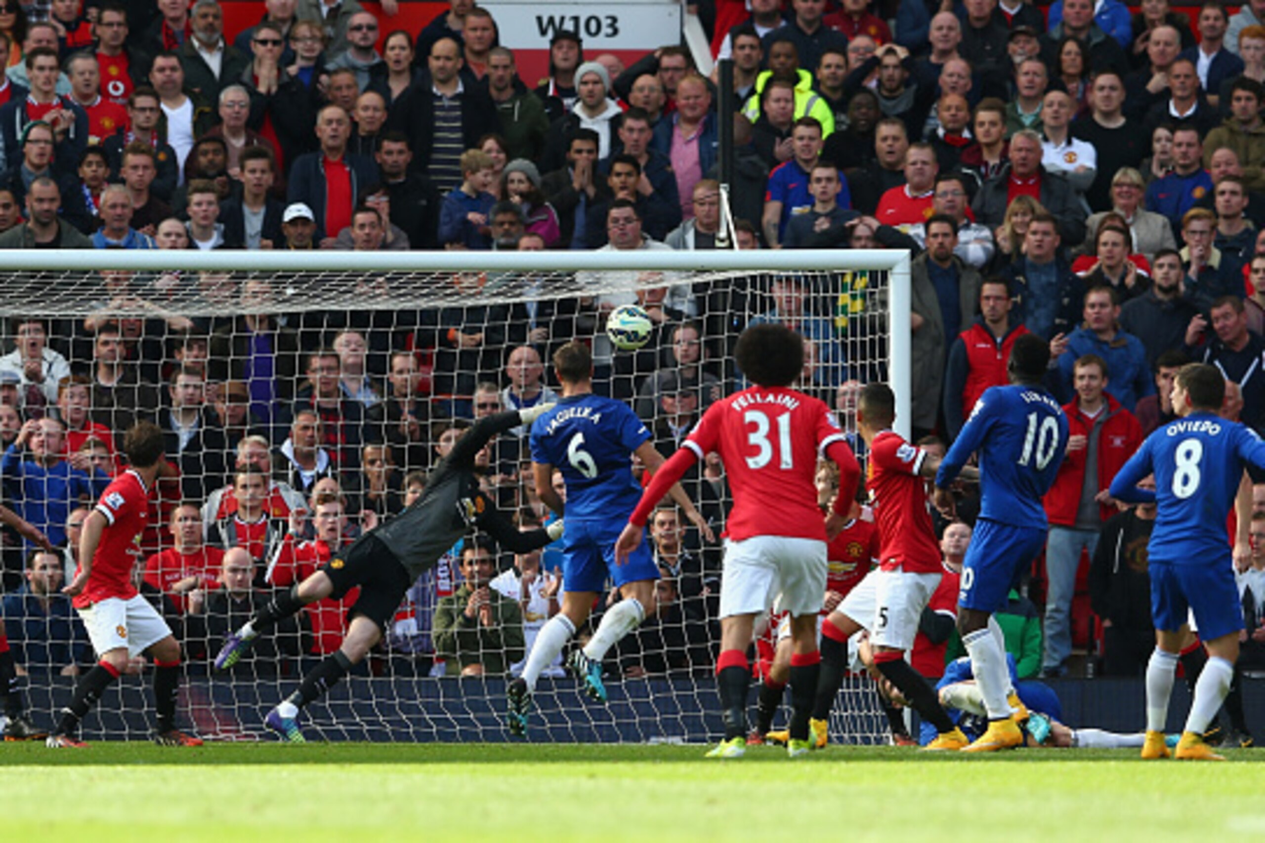 MANCHESTER, ENGLAND - OCTOBER 05:  David De Gea of Manchester United saves the shot of Bryan Oviedo of Everton during the Barclays Premier League match between Manchester United and Everton at Old Trafford on October 5, 2014 in Manchester, England.  (Phot