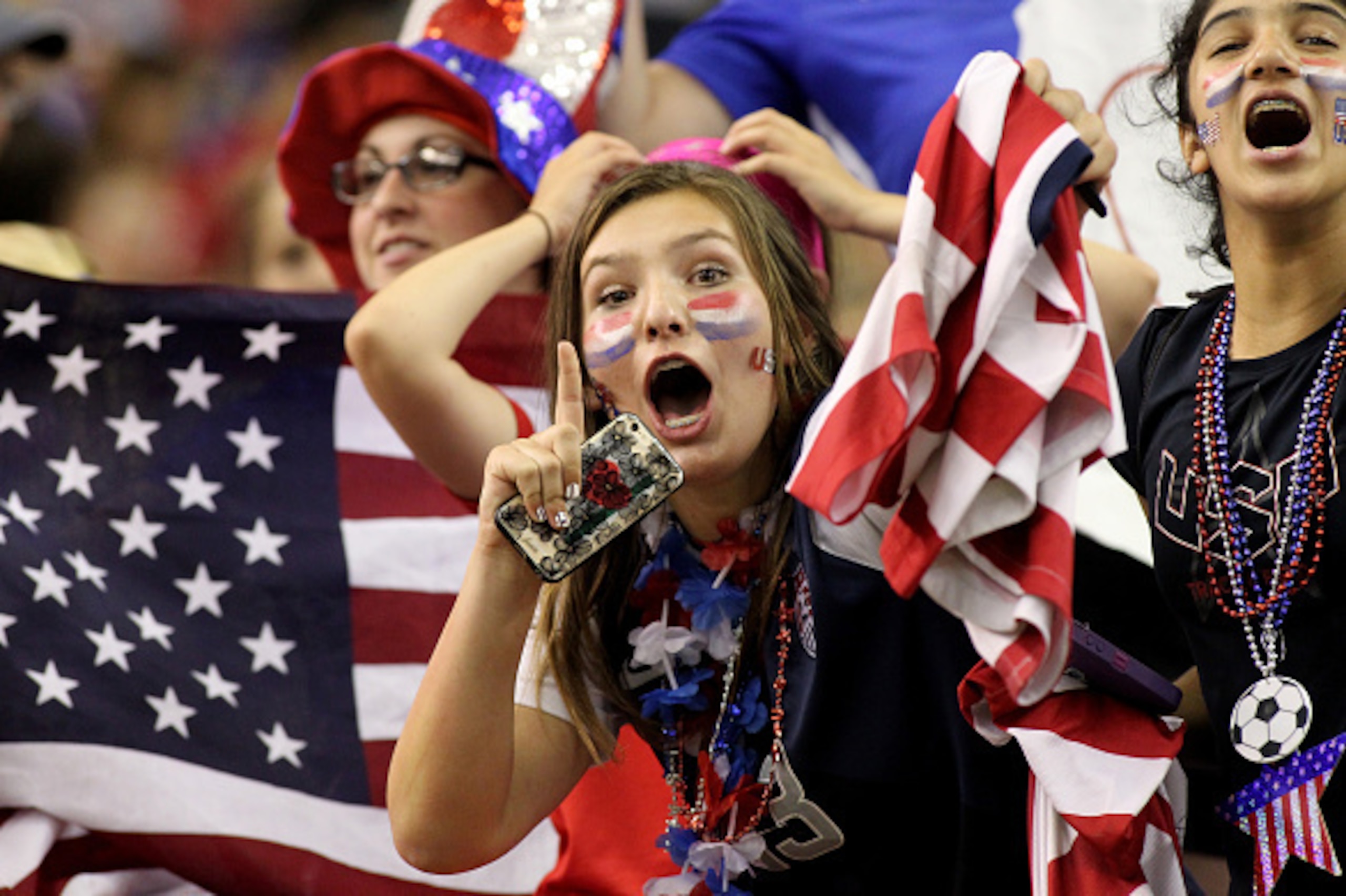 MONTREAL, QC - JUNE 30:  Fans of the United States celebrate after the USA 2-0 victory against Germany in the FIFA Women's World Cup 2015 Semi-Final Match at Olympic Stadium on June 30, 2015 in Montreal, Canada.  (Photo by Francois Laplante/FreestylePhoto