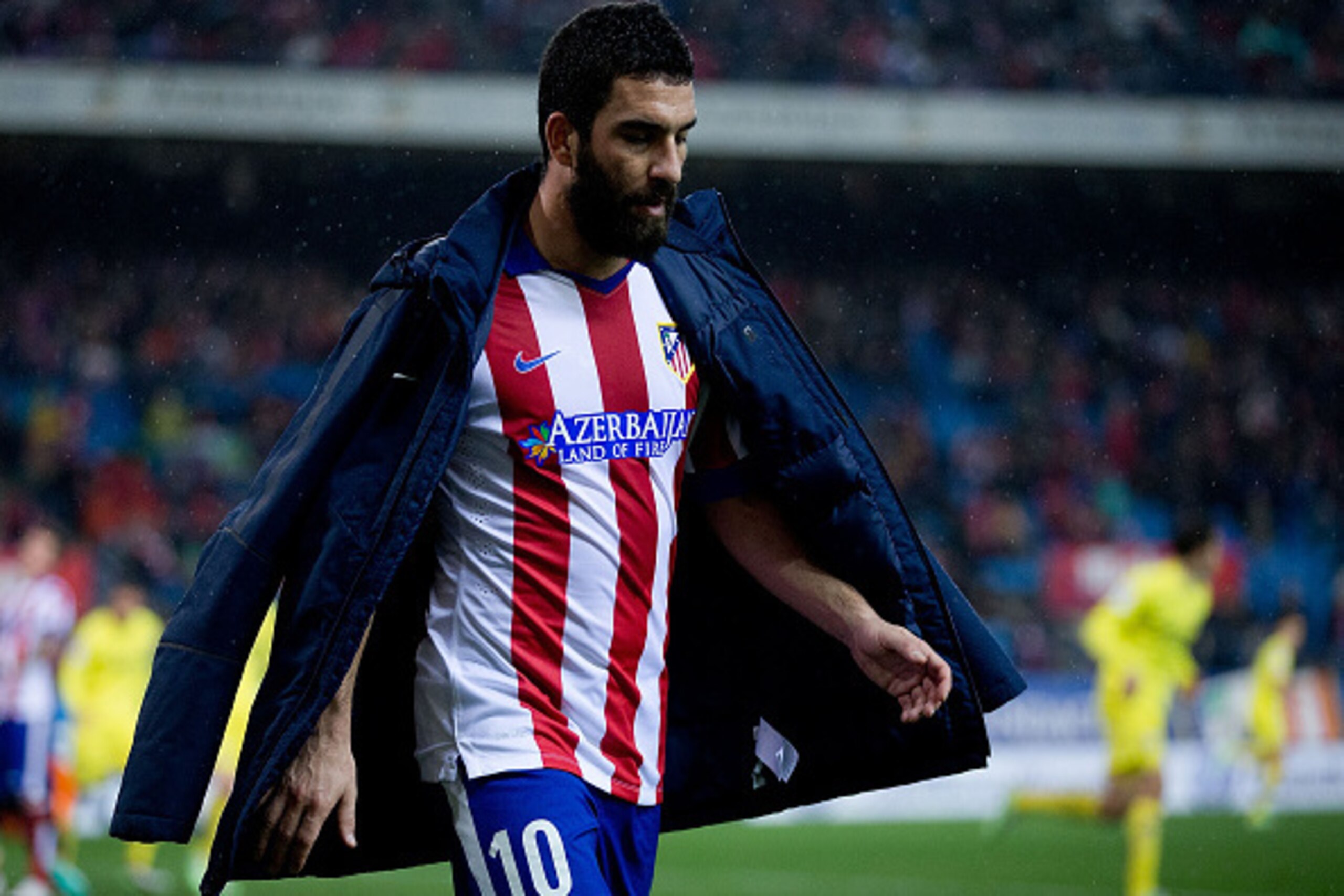 MADRID, SPAIN - DECEMBER 14: Arda Turan of Atletico de Madrid leaves the picth during the La Liga match between Club Atletico de Madrid and Villarreal CF at Vicente Calderon Stadium on December 14, 2014 in Madrid, Spain.  (Photo by Gonzalo Arroyo Moreno/G