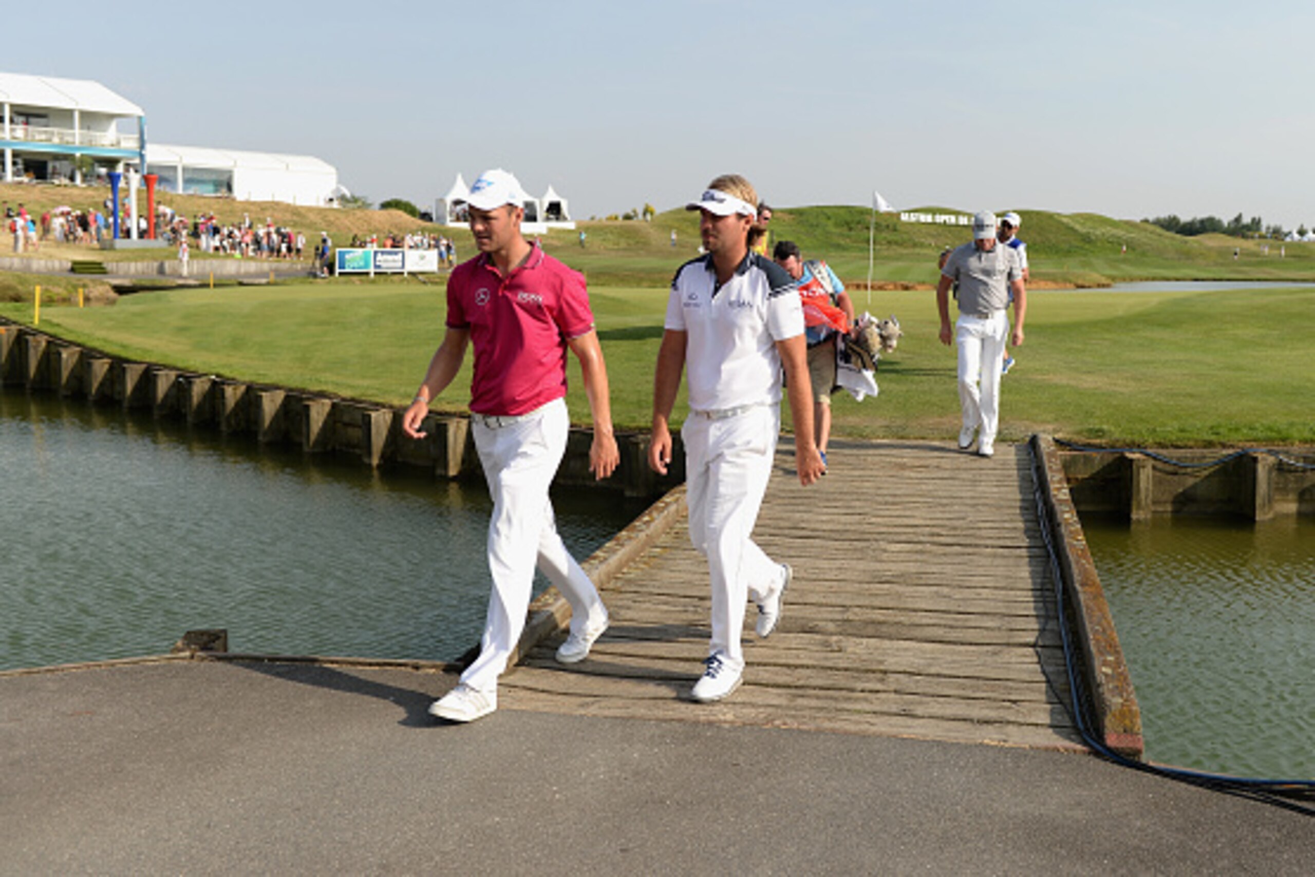 PARIS, FRANCE - JULY 03:  Martin Kaymer of Germany and Victor Dubuisson of France walk off the 18th green after both finishing at 4 under par during the Alstom Open de France - Day Two at Le Golf National on July 3, 2015 in Paris, France.  (Photo by Tony 