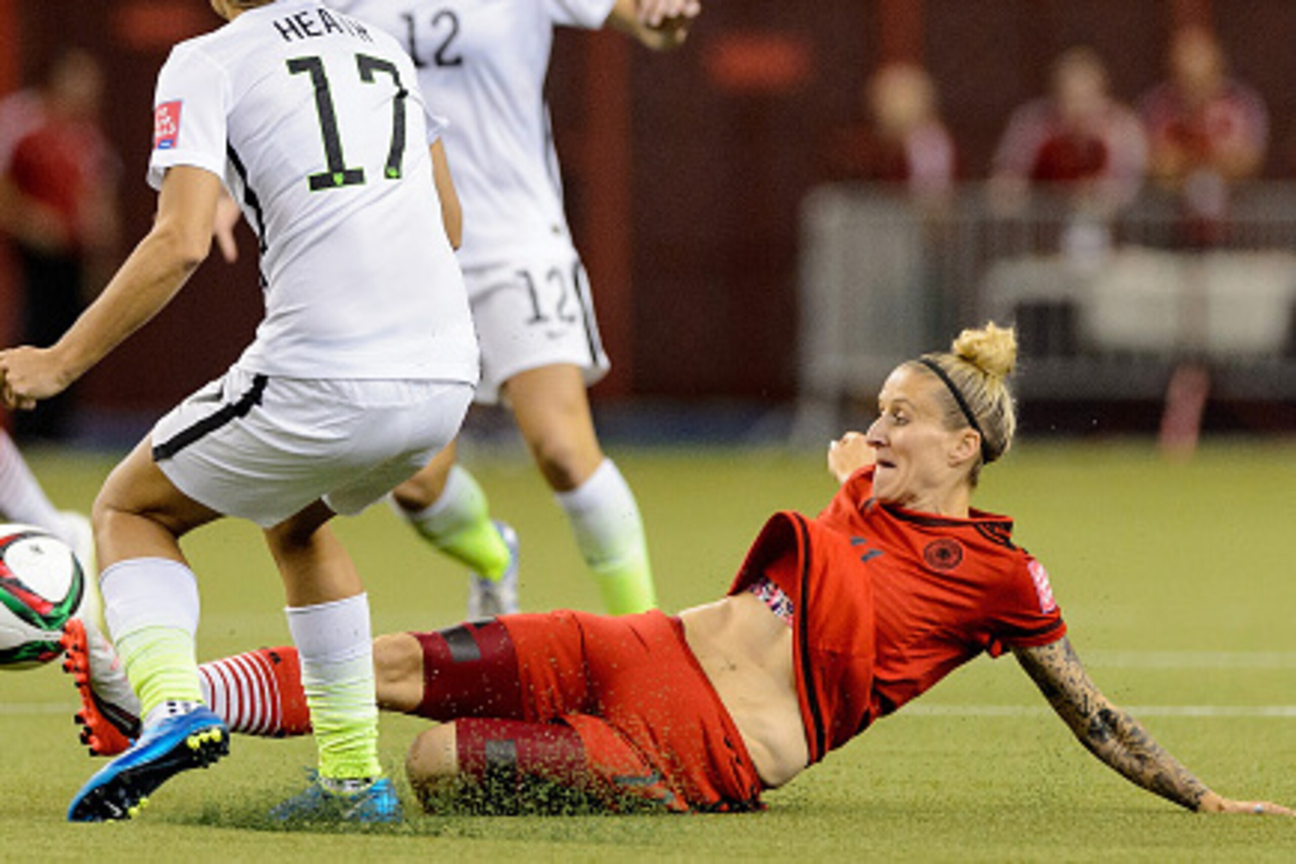 MONTREAL, QC - JUNE 30:  Anja Mittag #11 of Germany kicks the ball away from Tobin Heath #17 of the United States in the first half in the FIFA Women's World Cup 2015 Semi-Final Match at Olympic Stadium on June 30, 2015 in Montreal, Canada.  (Photo by Min