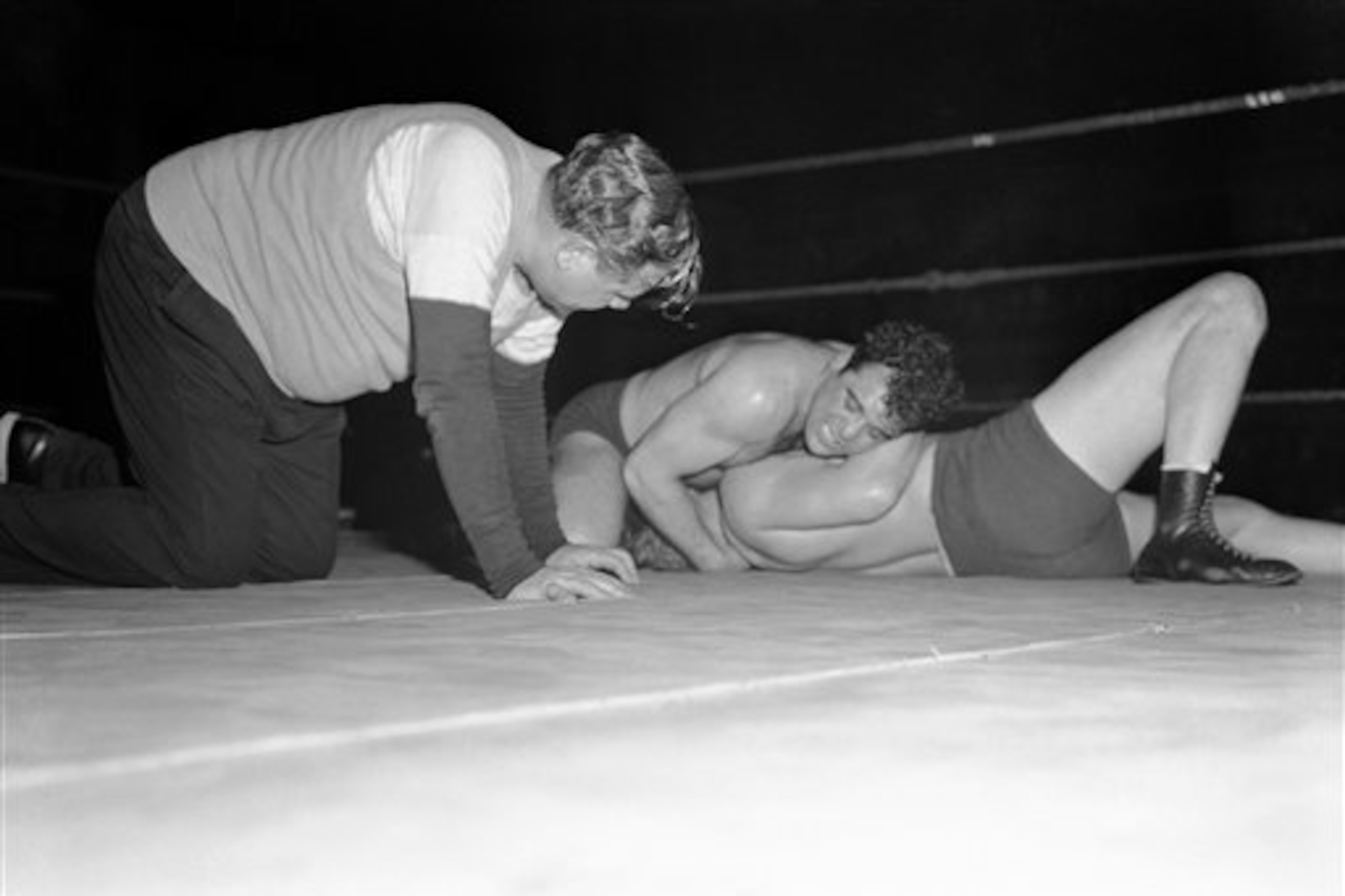Babe Ruth keeps an eye on the grapplers.