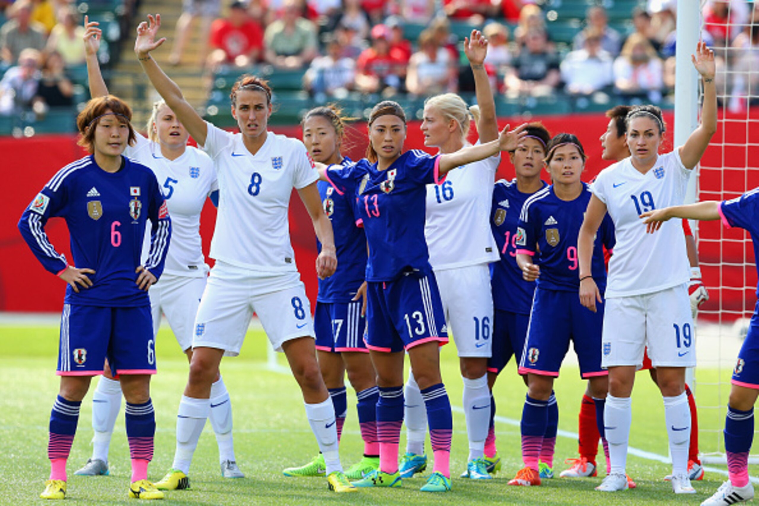 EDMONTON, AB - JULY 01: England and Japan players wait for a corner kick during the FIFA Women's World Cup Semi Final match between Japan and England at the Commonwealth Stadium on July 1, 2015 in Edmonton, Canada. (Photo by Ronald Martinez/Getty Images) EDMONTON, AB - JULY 01: England and Japan players wait for a corner kick during the FIFA Women's World Cup Semi Final match between Japan and England at the Commonwealth Stadium on July 1, 2015 in Edmonton, Canada. (Photo by Ronald Martinez/Getty Images)