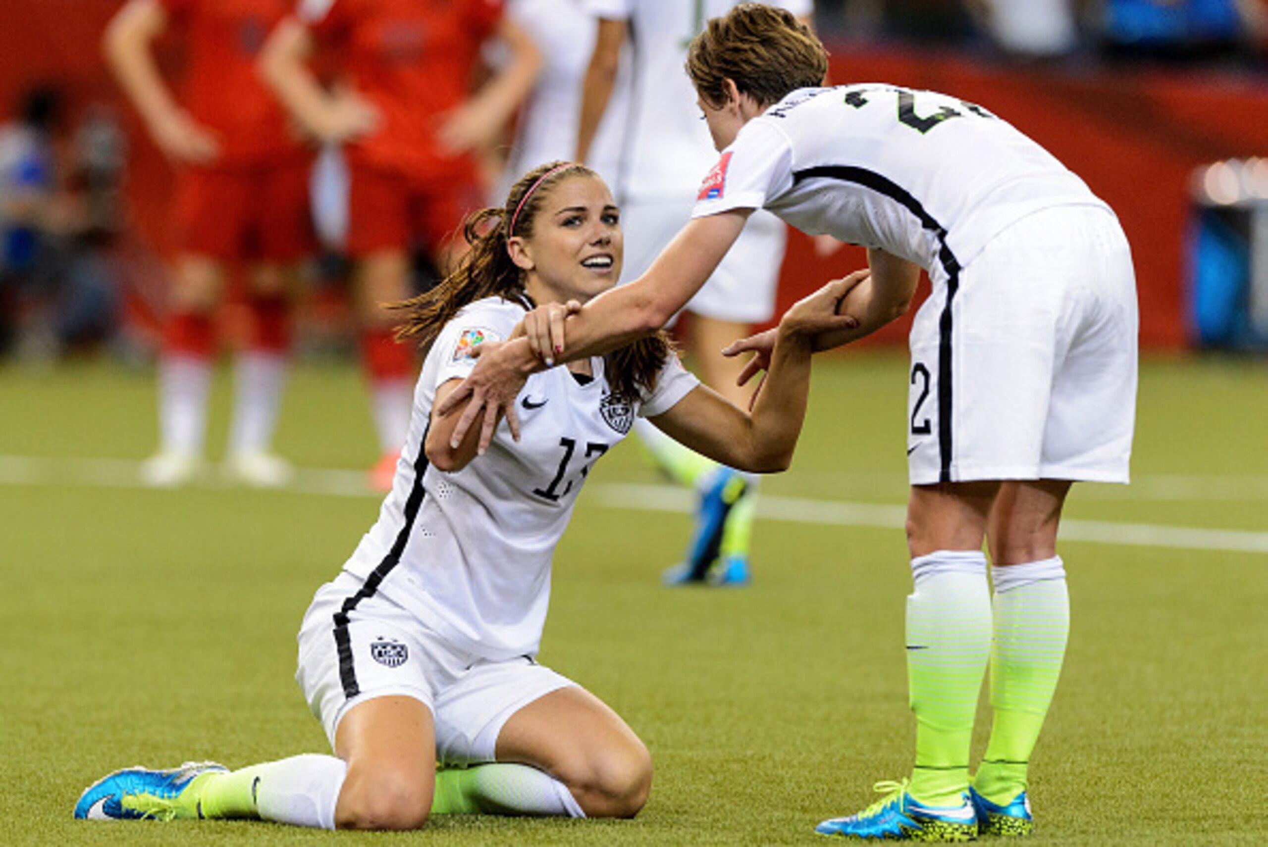 MONTREAL, QC - JUNE 30: Alex Morgan #13 of the United States reacts with teammate Meghan Klingenberg #22 after Morgan was fouled in the box in the second half against Germany in the FIFA Women's World Cup 2015 Semi-Final Match at Olympic Stadium on June MONTREAL, QC - JUNE 30: Alex Morgan #13 of the United States reacts with teammate Meghan Klingenberg #22 after Morgan was fouled in the box in the second half against Germany in the FIFA Women's World Cup 2015 Semi-Final Match at Olympic Stadium on June