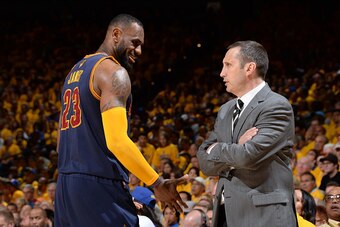 OAKLAND, CA - JUNE 7: LeBron James #23 and David Blatt of the Cleveland Cavaliers converse during Game Two of the 2015 NBA Finals on June 7, 2015 at Oracle Arena in Oakland, California. NOTE TO USER: User expressly acknowledges and agrees that, by downloa