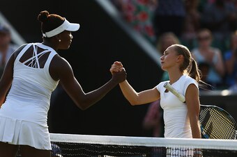 LONDON, ENGLAND - JULY 03:  Venus Williams of the United States is congratulated on winning her LadiesÂ Singles Third Round match at the net by Aleksandra Krunic of Serbia during day five of the Wimbledon Lawn Tennis Championships at the All England Lawn